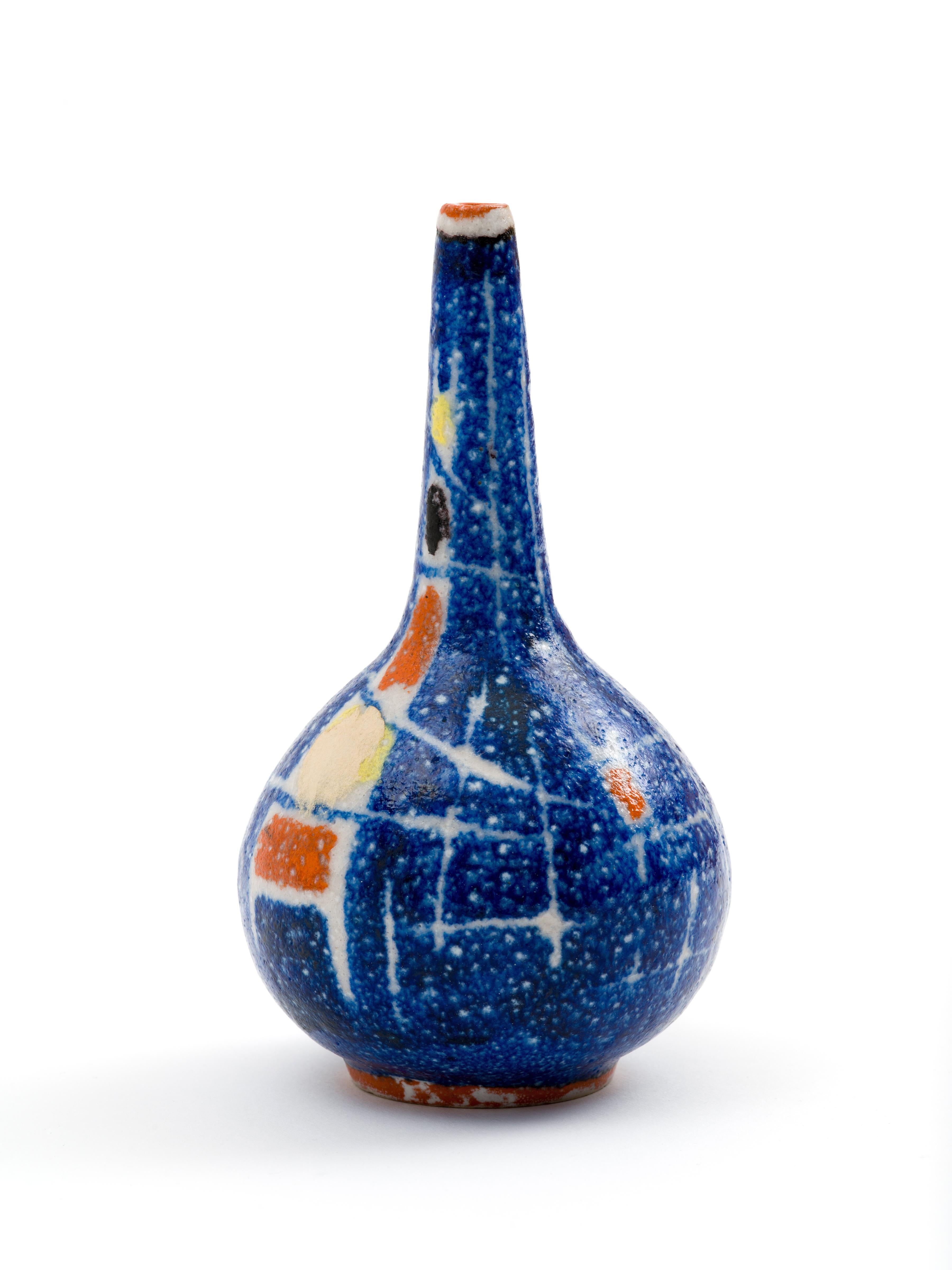 A small vase realized in salt-glazed ceramic with applied modernist, abstract design in rich primary colors by Italian ceramicist, Andrea D’Arienzo. If the design and execution here look remarkably like those of Guido Gambone, there’s good reason -