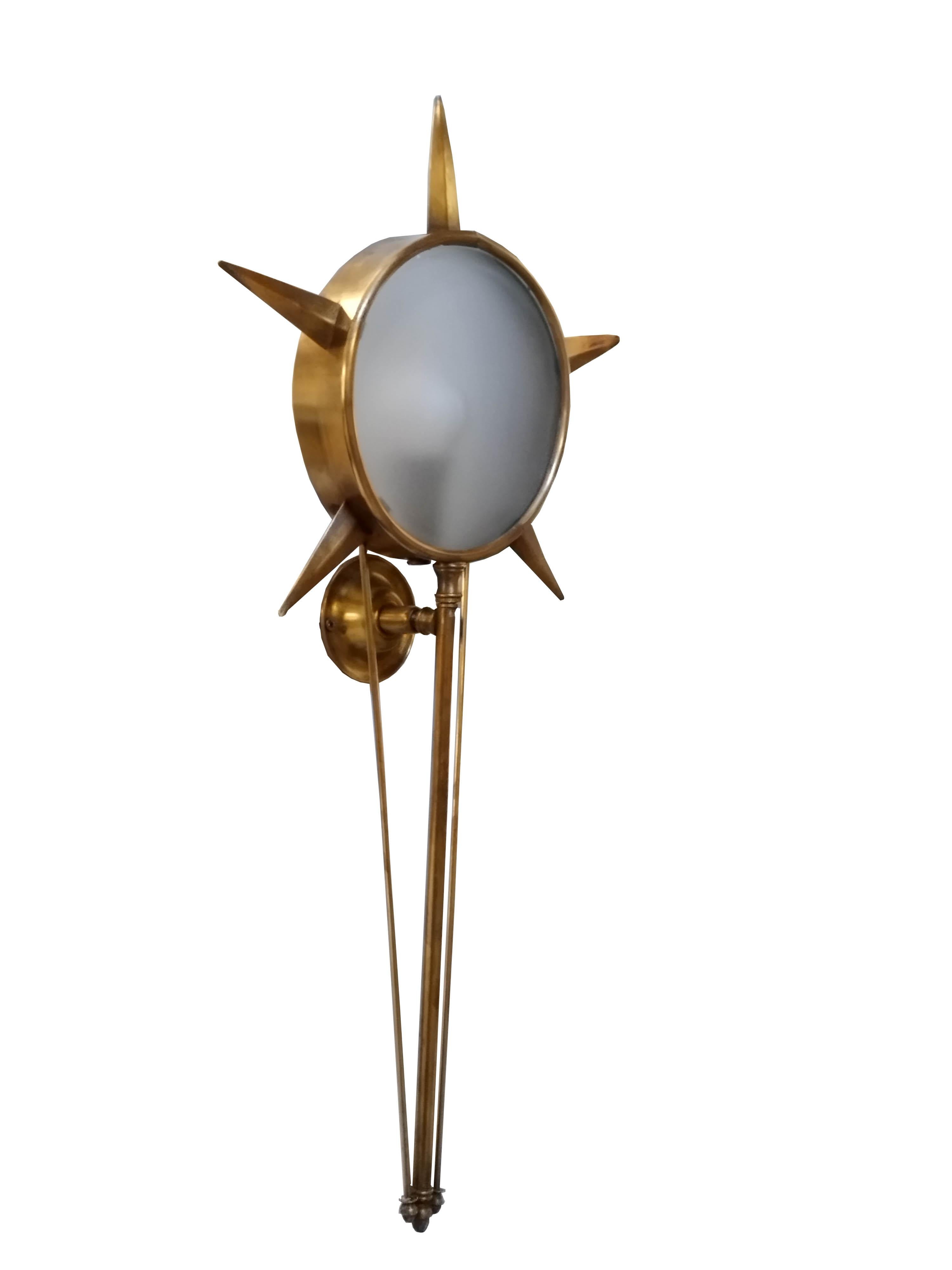 Rare and unusual wall lamp made of brass and satin-finish opaline glass. The lamp is reminiscent in design of  Gio Ponti. Italian production attrib. Arredoluce.

