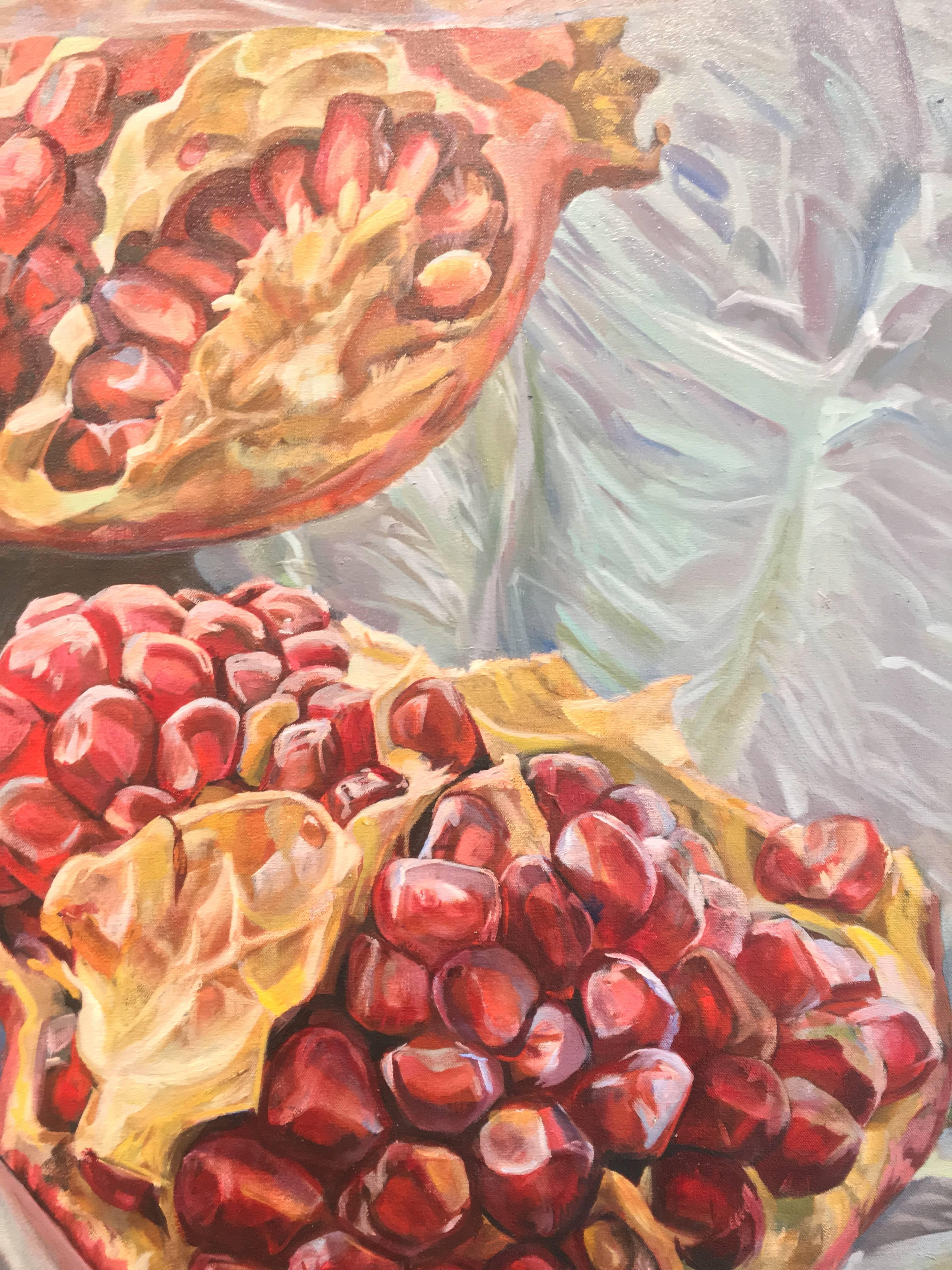 In this large, horizontal oil painting on canvas, bright burgundy and crimson red seeds spill out from inside an opened pomegranate, its sensuous form spread across a three panel composition. The rich, vibrant shades of rouge within the fruit are