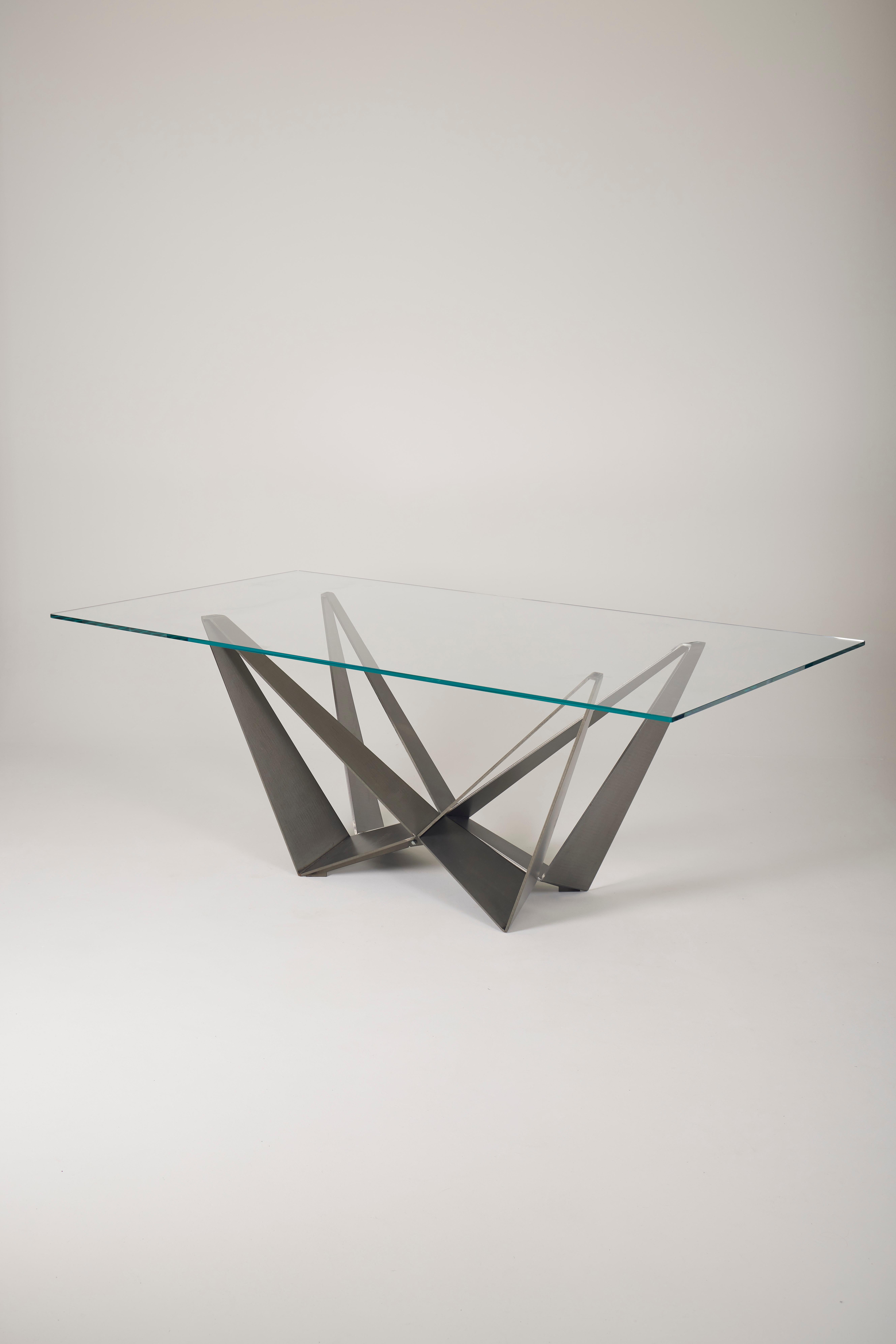 Dining table Skorpio by Italian designer Andrea Lucatello. The geometric base is made of metal, and the tabletop is glass. In very good condition.
LP1919