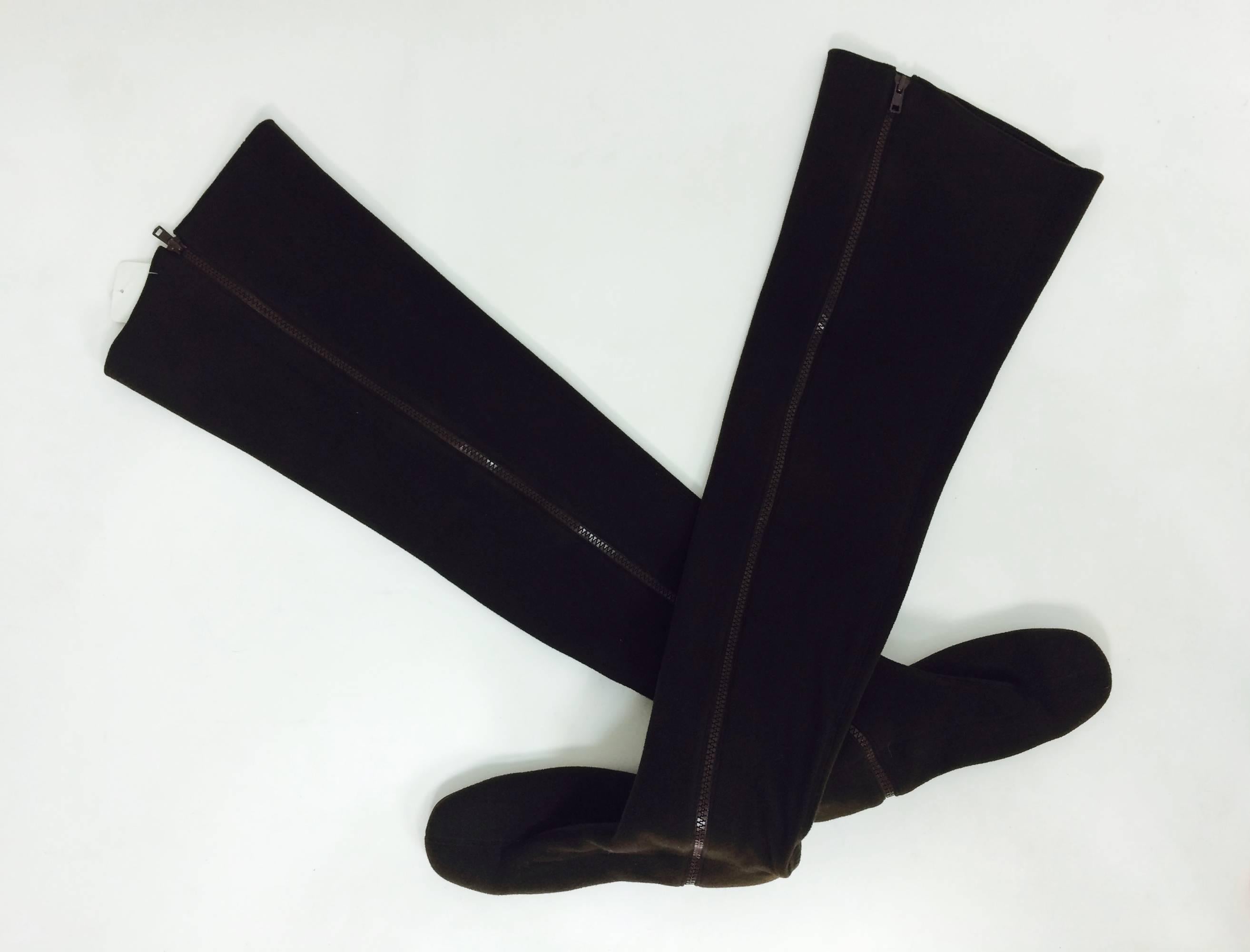 Andrea Pfister thigh high chocolate brown neoprene, side zipper boots. Velvety textured neoprene fabric with a bit of stretch, the boots close at each side with a heavy brown plastic zipper. Leather soles and heels with leather trims. These boots