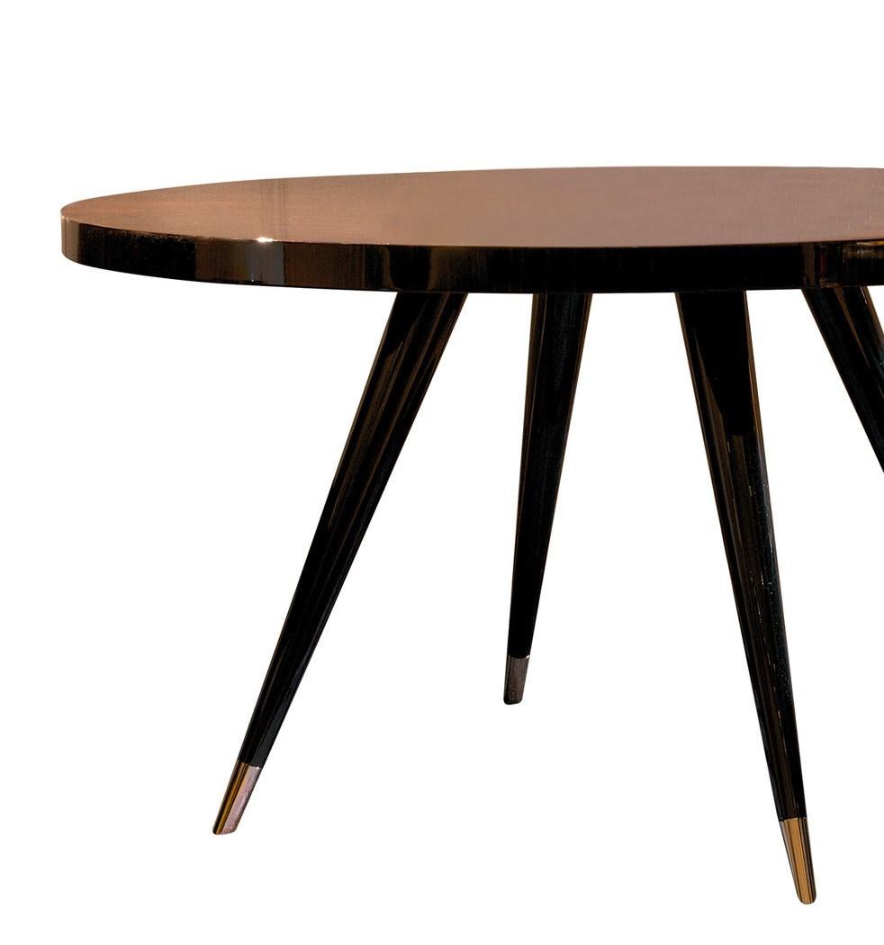Striking and timeless, this dining table is an elegant addition to a modern or Classic interior. Its versatility is due to the superb craftsmanship and the use of exquisite materials that will enrich any dining room, breakfast nook, or study. The