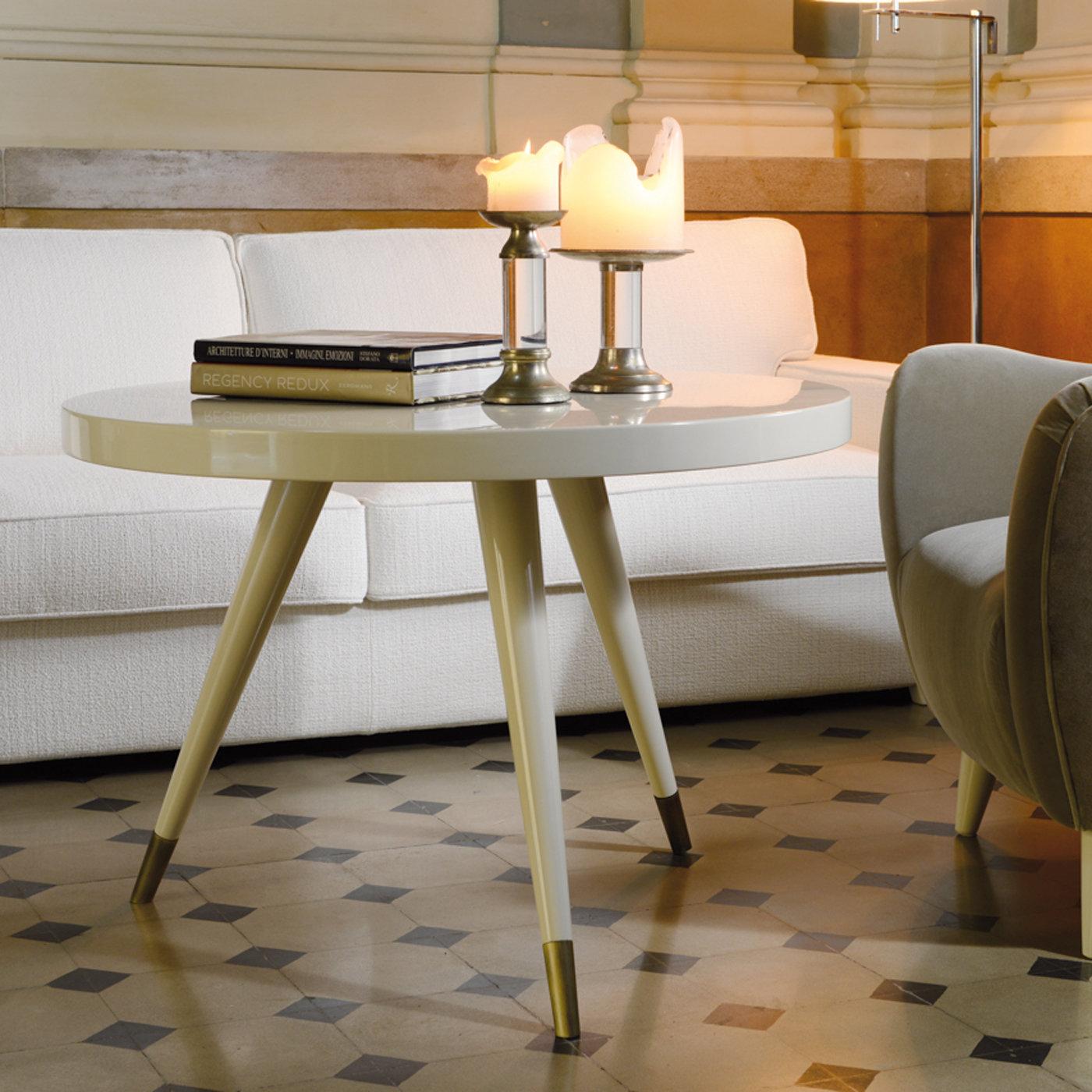 A stunning complement to a modern home, this refined side table is part of the most prestigious collection by DOM Edizioni designed by Domenico Mula. The charming silhouette features a wooden frame with an ivory, glossy lacquer that pairs well with