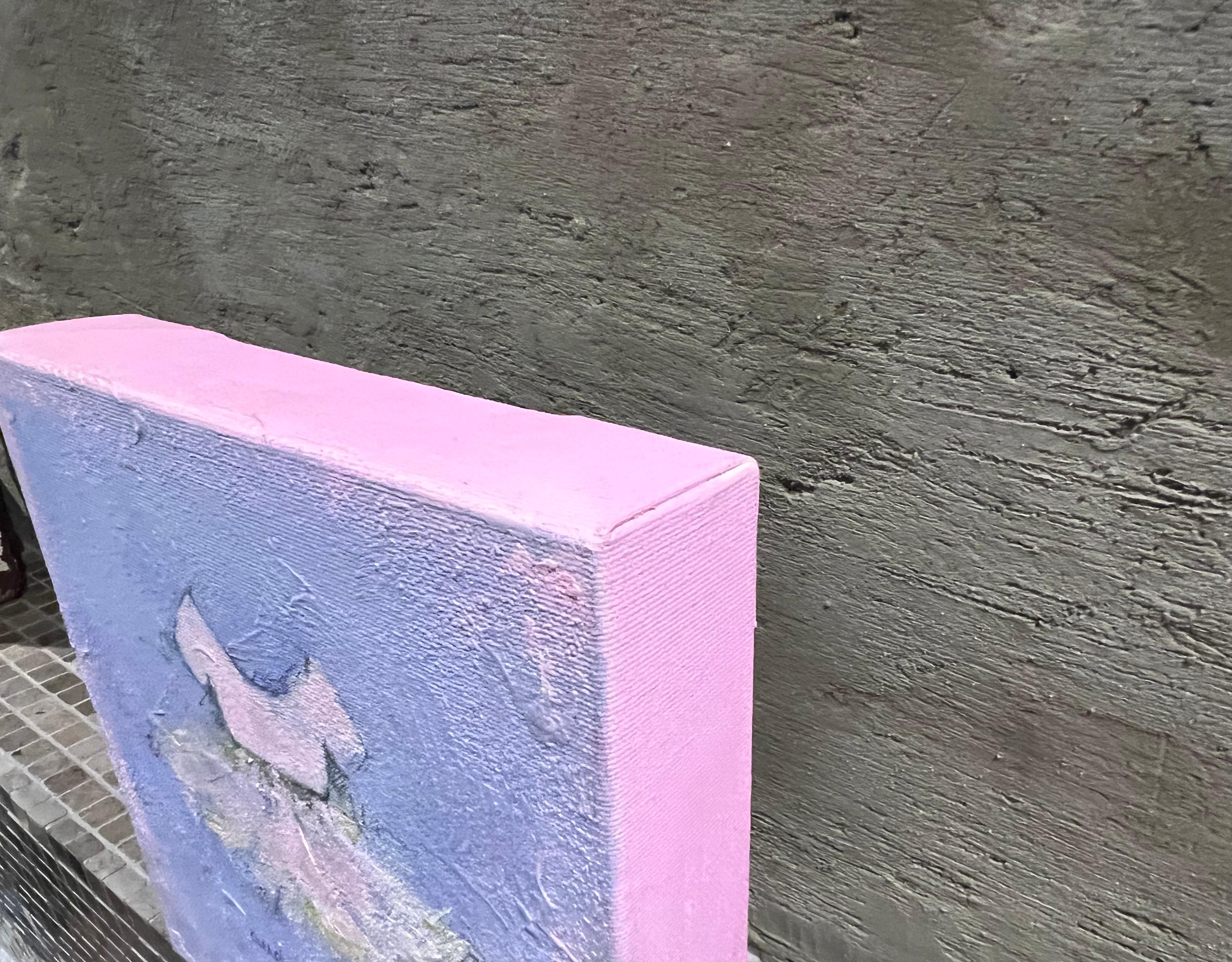 This is an original painting on canvas featuring a child's ballerina tutu in soft shades of pink, mauve and touches of green. The painting comes to life with soft, flowing brushstrokes. Layers of paint create texture and movement, while a hint of