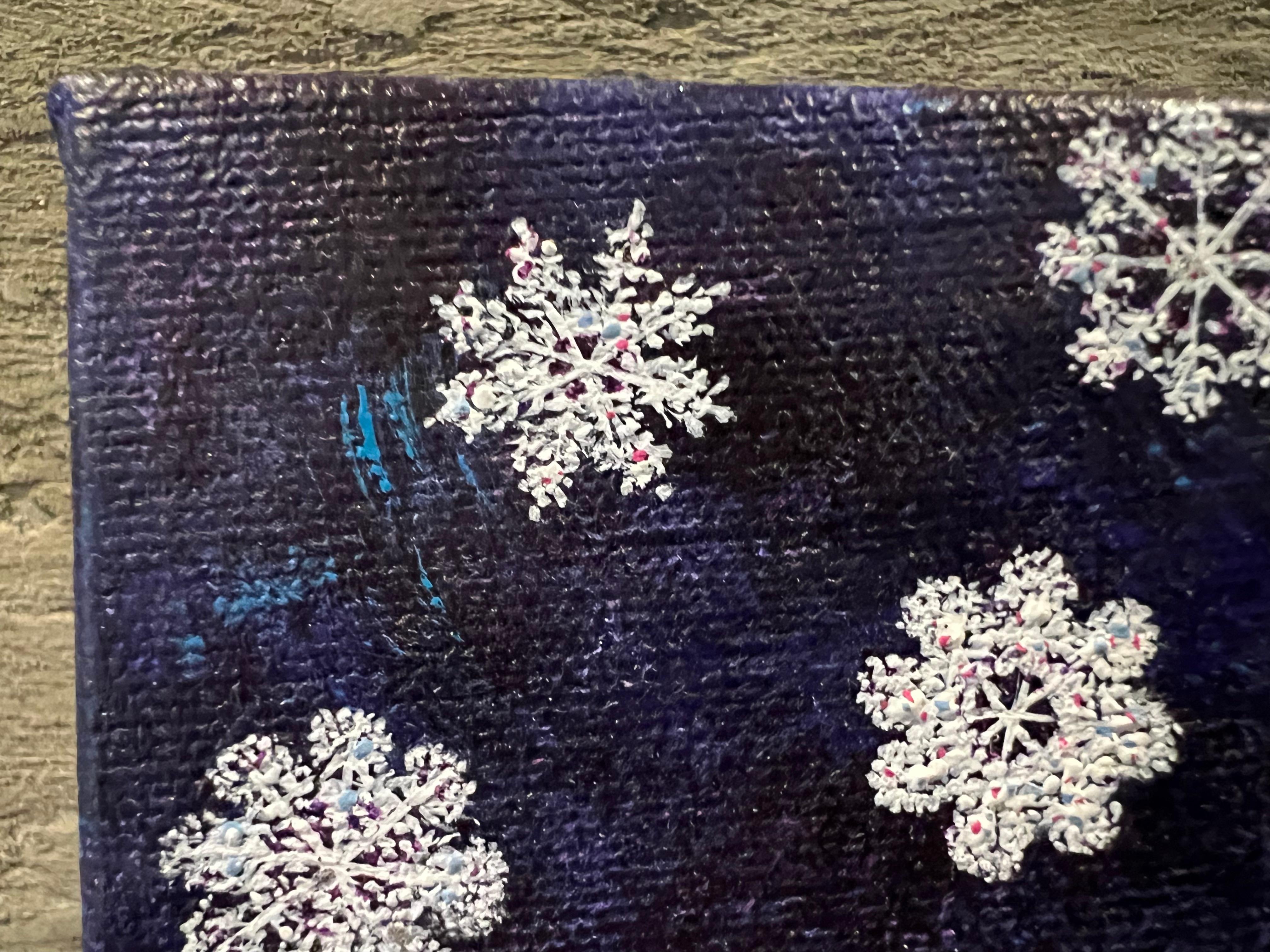 So little with so much to say. Discover the charm of this petite painting that speaks volumes. Intricate snowflakes glisten softly against a serene winter night sky. It's beauty lies in the highly delicate details within each unique snowflake. Using