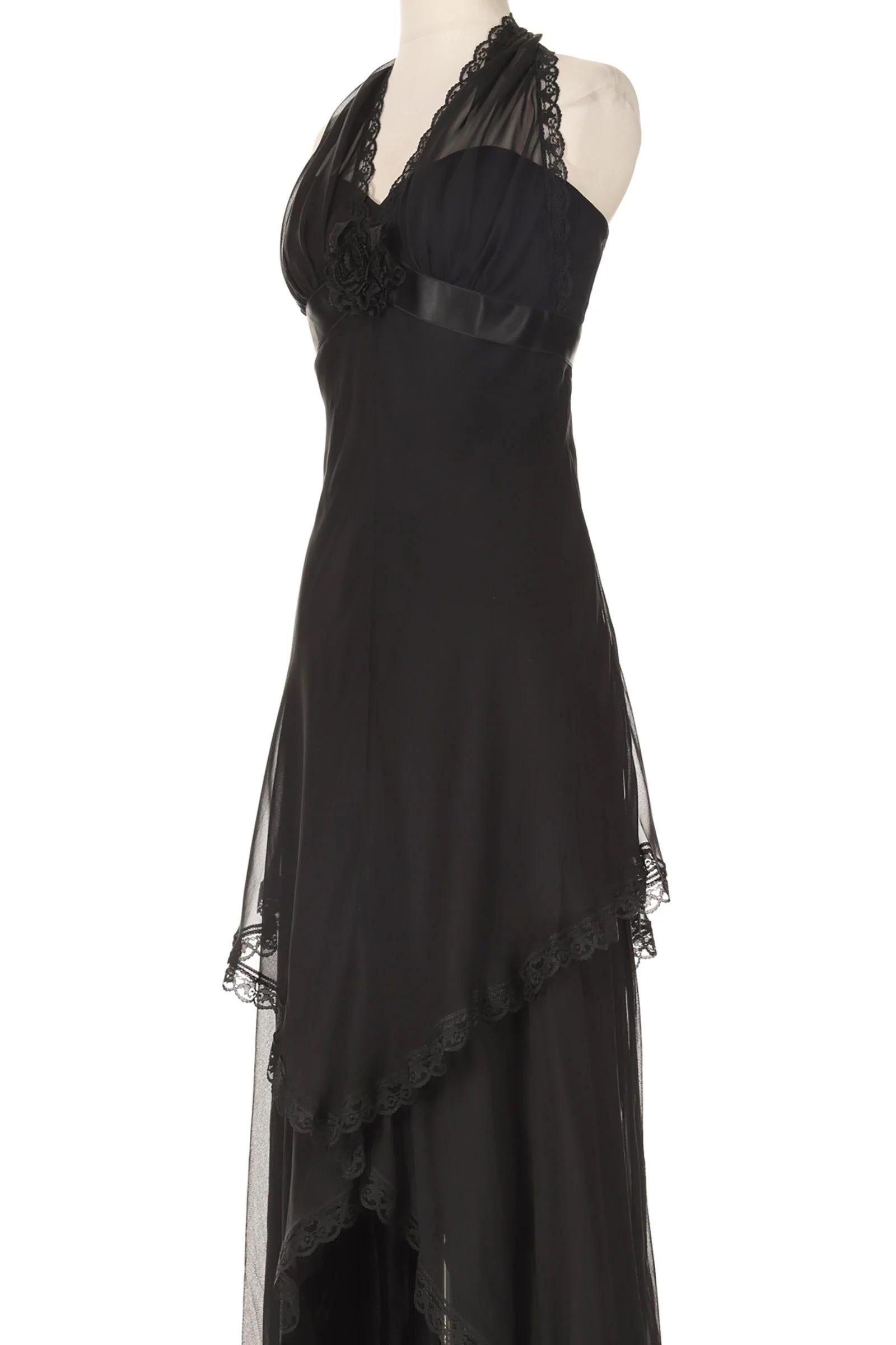 VINTAGE GRACE NY

A beautiful, gypsy-like gown from Los Angeles institution, Andrea's Fashion. This vintage black silk chiffon gown is a stunning fusion of gothic romance and ethereal elegance. The halter neckline ties delicately at the nape,