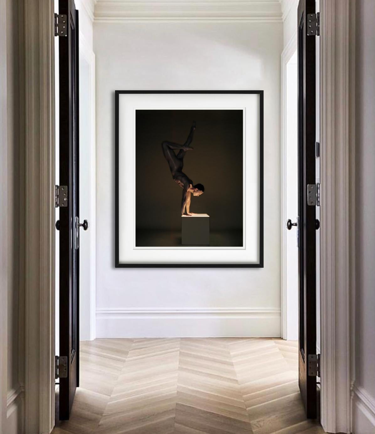 Mickey Vienna - male nude in acrobatic pose, Fine Art Photography, 2002 - Black Nude Photograph by Andreas H. Bitesnich