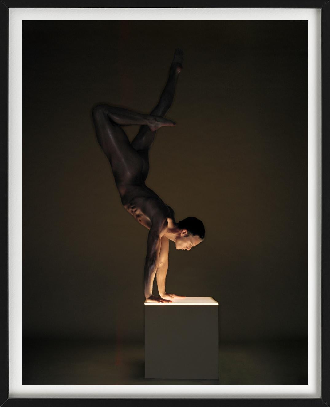 Male Nude, striking an athletic pose, photographed by Andreas H. Bitensich. 

Available in multiple sizes. All prints are limited edition. High-end framing on request.

All prints are done and signed by the artist. The collector receives an
