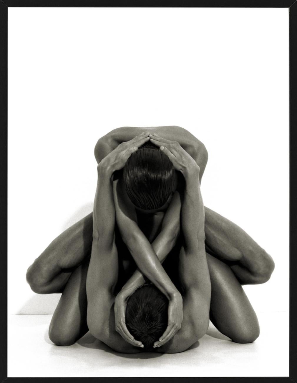 Yvonne & Tom, nude photograph of man and woman intertwined in embrace - Photograph by Andreas H. Bitesnich