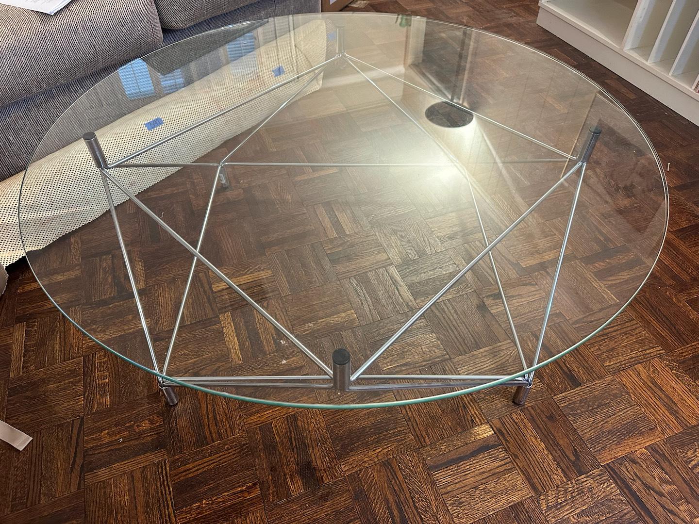The Glass “Spider” Table by Andreas Hansen and Niels Eilersen is a striking fusion of art and engineering, where elegance meets modern design. The table’s intricate frame is crafted from a network of chromium-plated stainless steel, meticulously