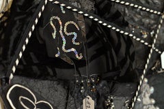 Remnants 3, Large Black dress with 17 small dresses sewn on