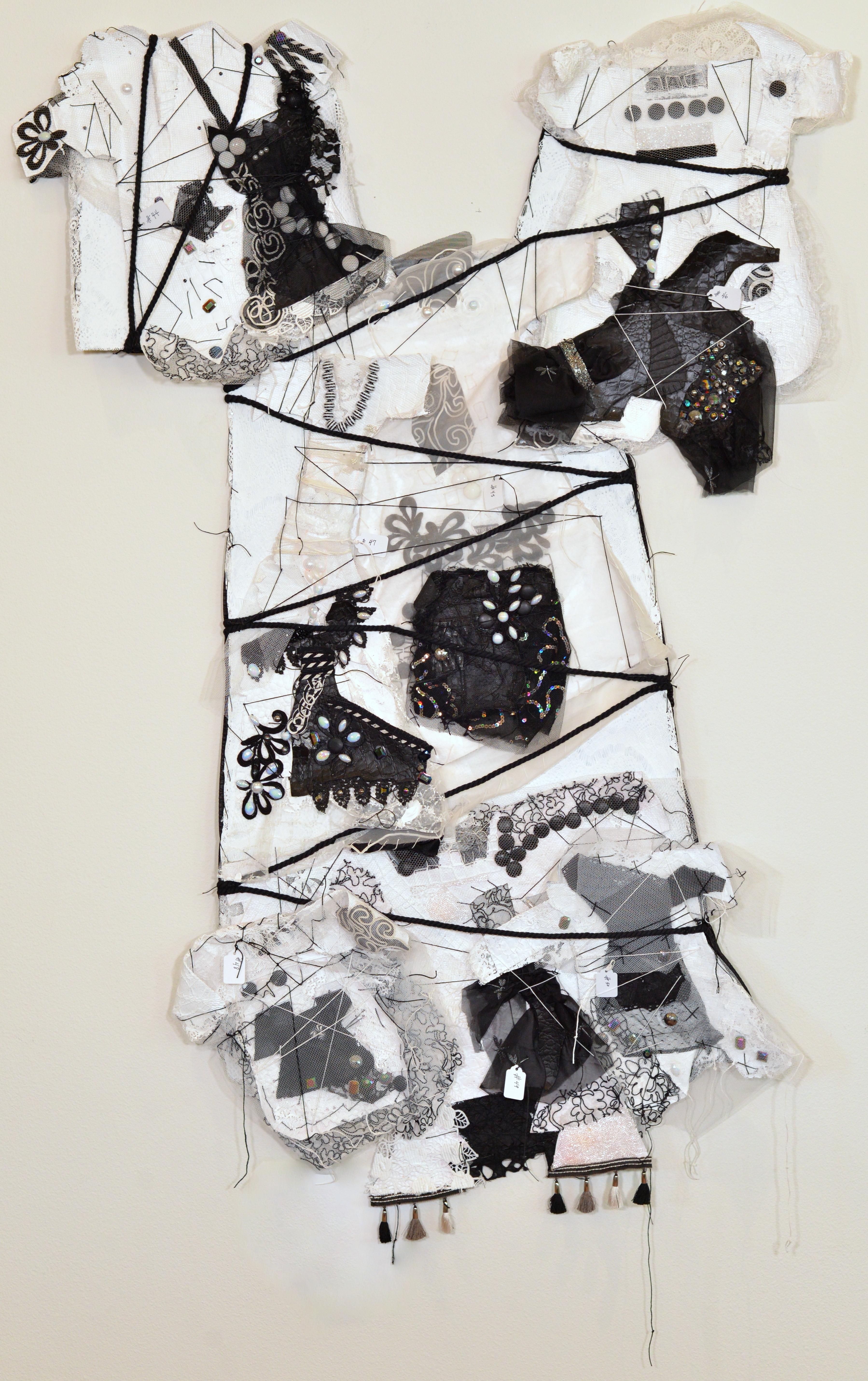 Remnants 6, Medium white and black dress with 6 small dresses attached - Art by Andrée Carter