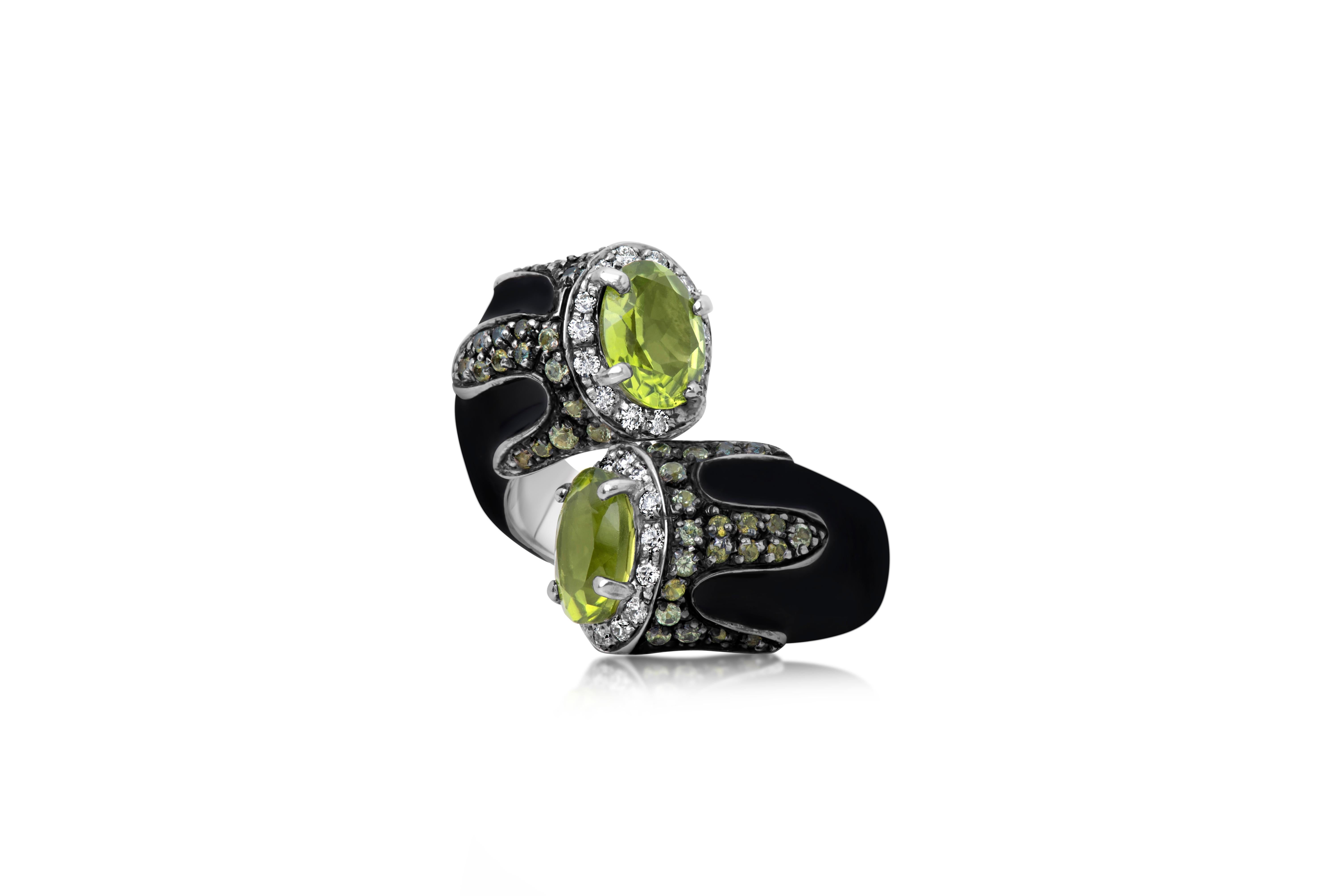 Andreoli Black Enamel Peridot Diamond Bypass Cocktail Ring Silver 18 Karat Gold

This Andreoli ring features:

- 0.38 carat Diamond (F-G-H Color, VS-SI Clarity)
- 3.75 carat Peridot
- Enamel
- 18 Karat White Gold
- Silver Base
- Made in Italy
- Ring