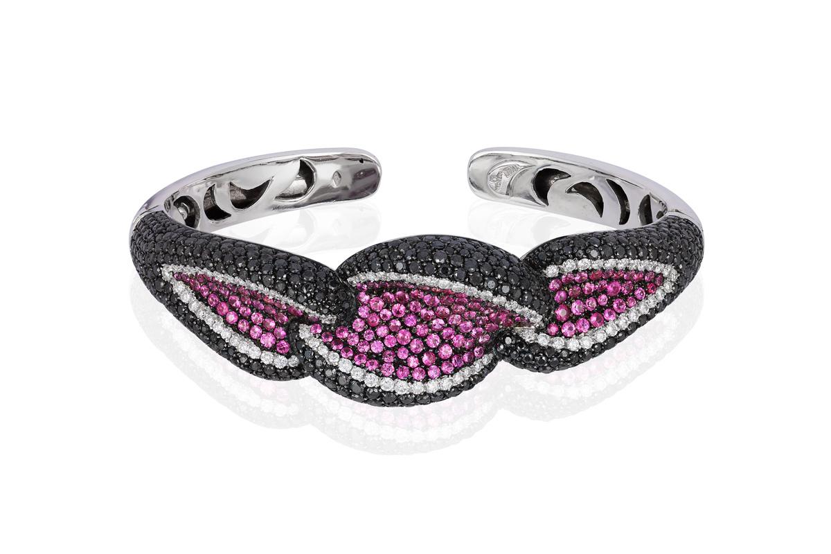 Andreoli Black White Diamond Pink Sapphire Cuff Bracelet 18KT White Blackened Rhodium where the Black Diamonds and Pink Sapphires are. This Bracelet Features a Double Sided Clasp Hinge Opening so you can easily wear the bracelet yourself by opening