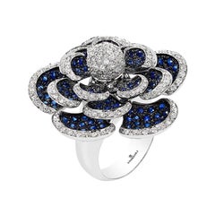 Andreoli Bague fleur en or blanc 18 carats avec saphir bleu et diamants en forme de pétales mobiles