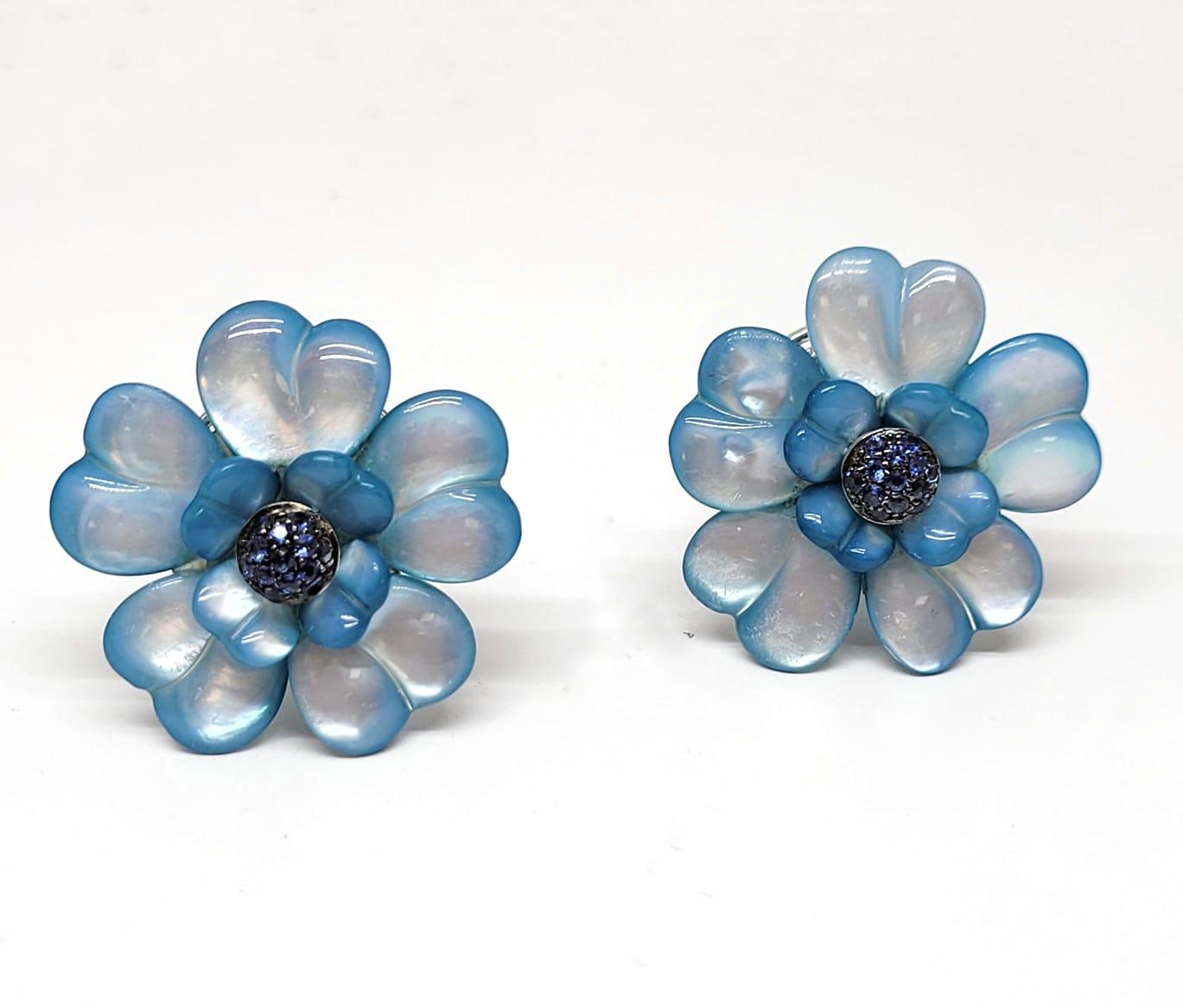Andreoli Blue Sapphire Blue Dyed Mother of Pearl 18 Karat Gold Flower Earrings Clip-On

These earrings feature:
- 0.59 Carat Blue Sapphire
- Blue Dyed Mother of Pearl
- 19.60 Gram 18K White Gold
- Made In Italy