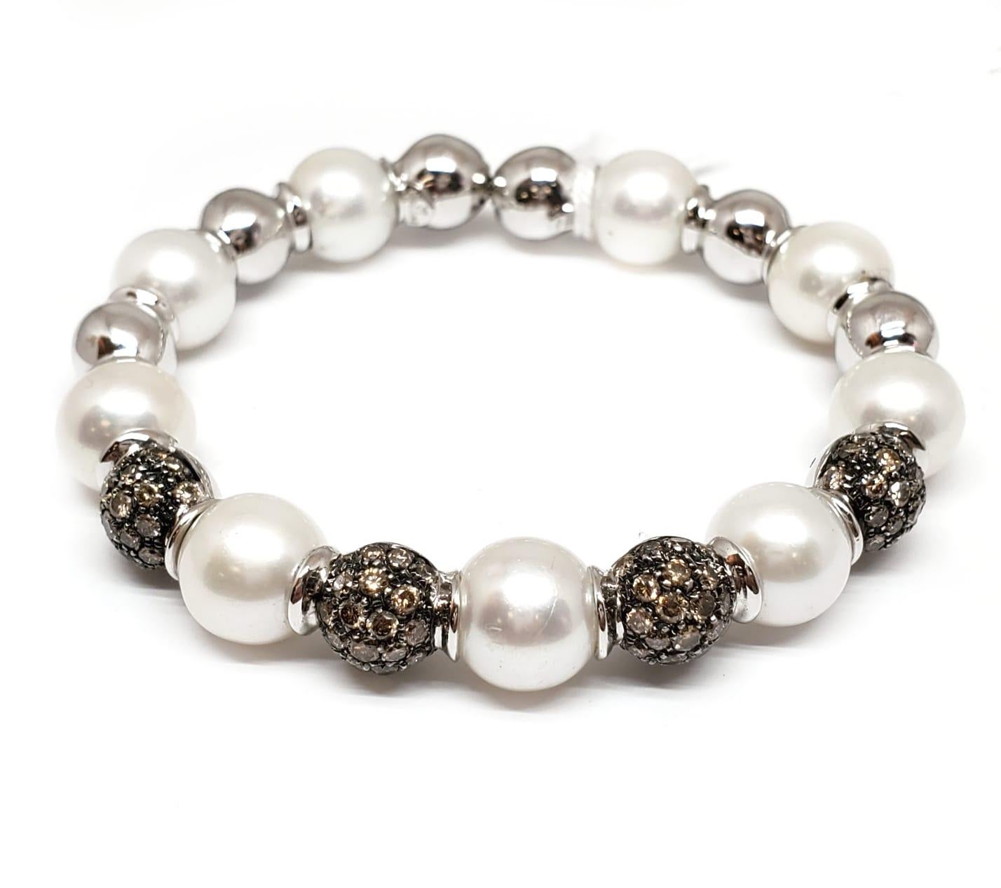 Andreoli Brown Diamond South Sea Pearl 18 Karat Gold Bracelet

This bracelet features:
- 3.38 Carat Brown Diamond
- South Sea Pearl
- 39.65 Gram 18K White Gold
- Made In Italy
