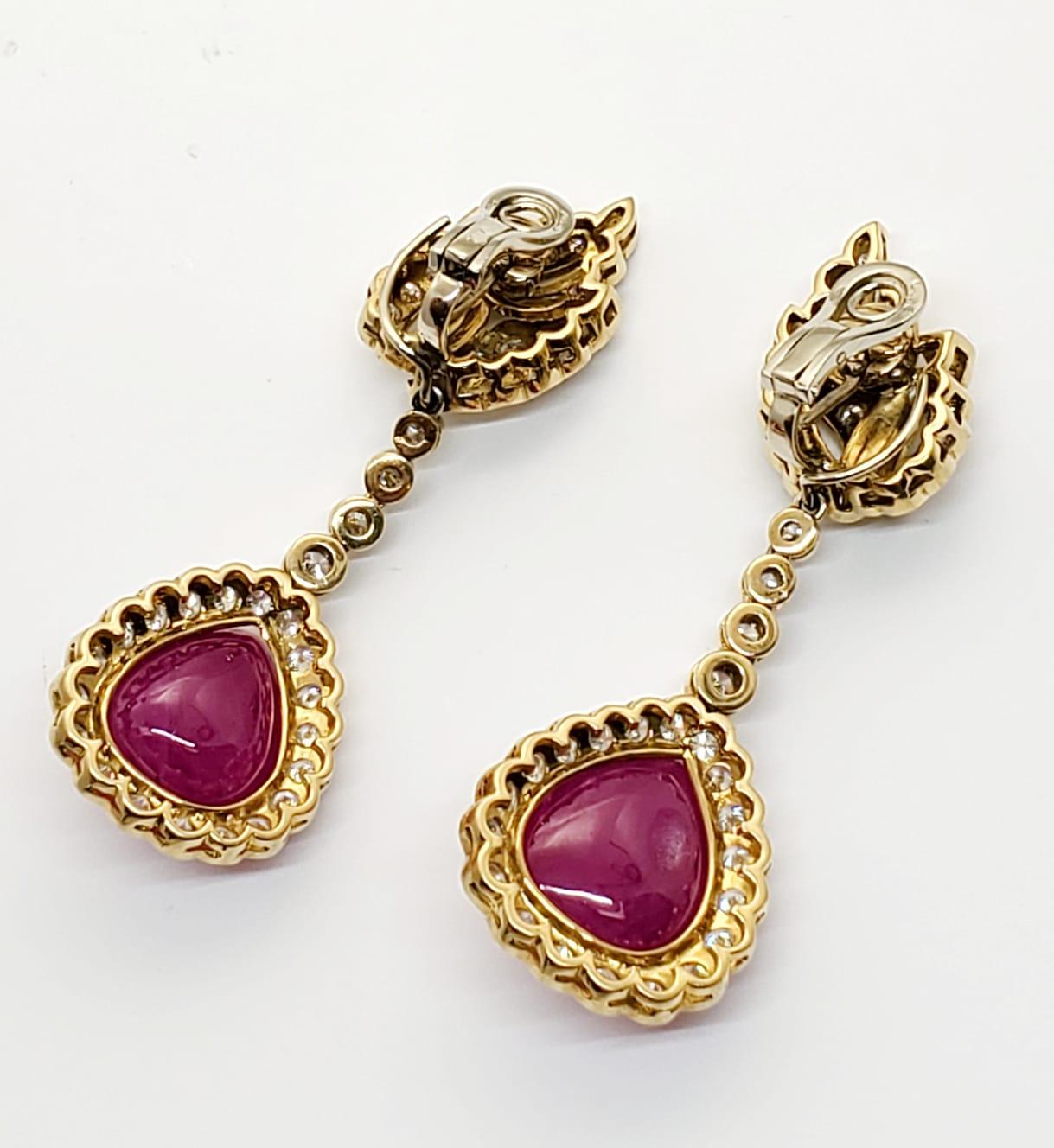 Andreoli Burma Ruby Cabochon Diamond Drop Earrings 18KT Yellow Gold

These Andreoli earrings feature two 49.75 carats of CDC Certified Burmese Rubies Tear Shape Cabochon accented with numerous full cut round brilliant diamonds weighing 7.23 carats