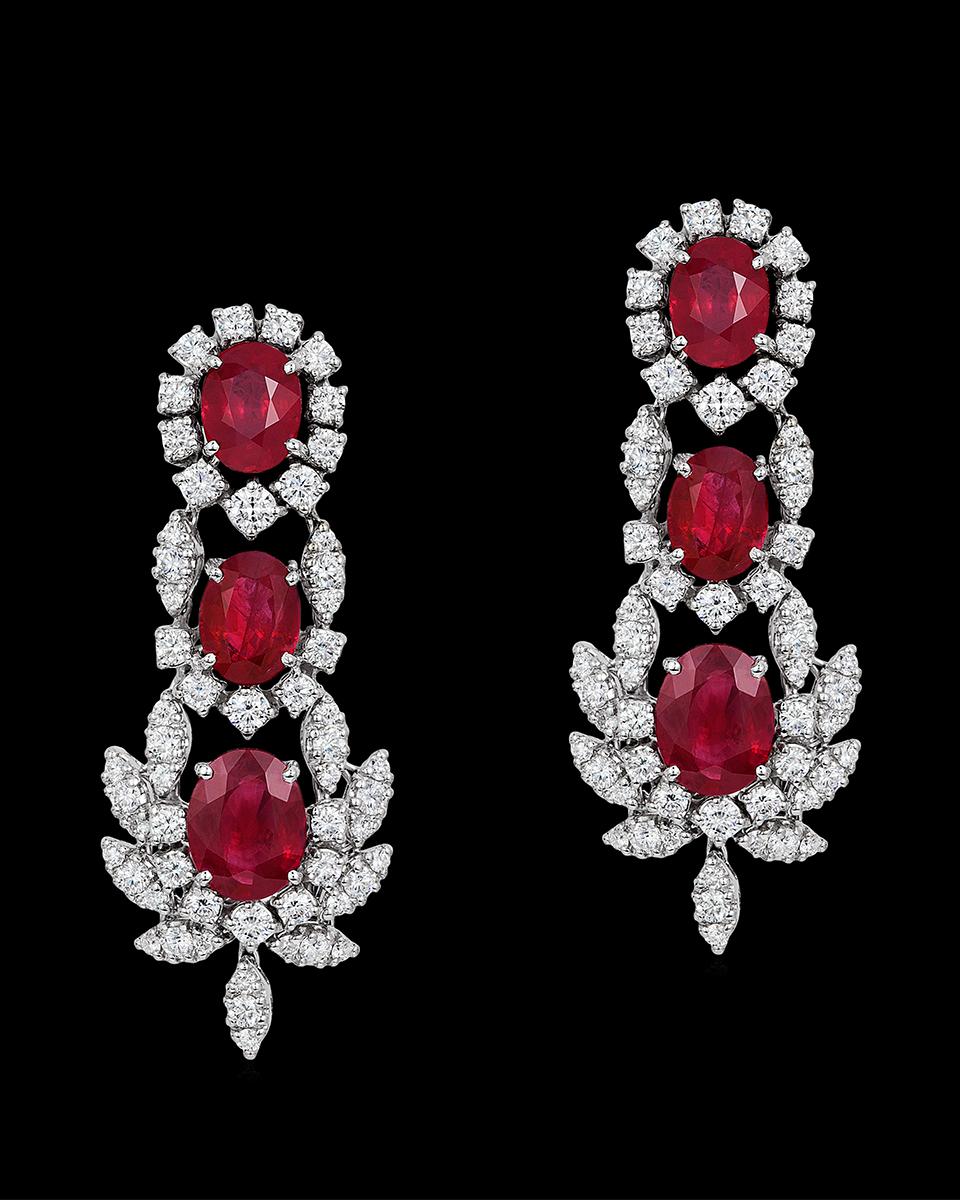 Andreoli Burma Ruby CDC Certified Diamond Statement Earrings 18 Karat White Gold.

These earrings feature 12.54 carats of Burma oval shaped rubies certified by C.Dunaigre swiss lab. Accented with 4.34 carats of full round brilliant cut diamonds