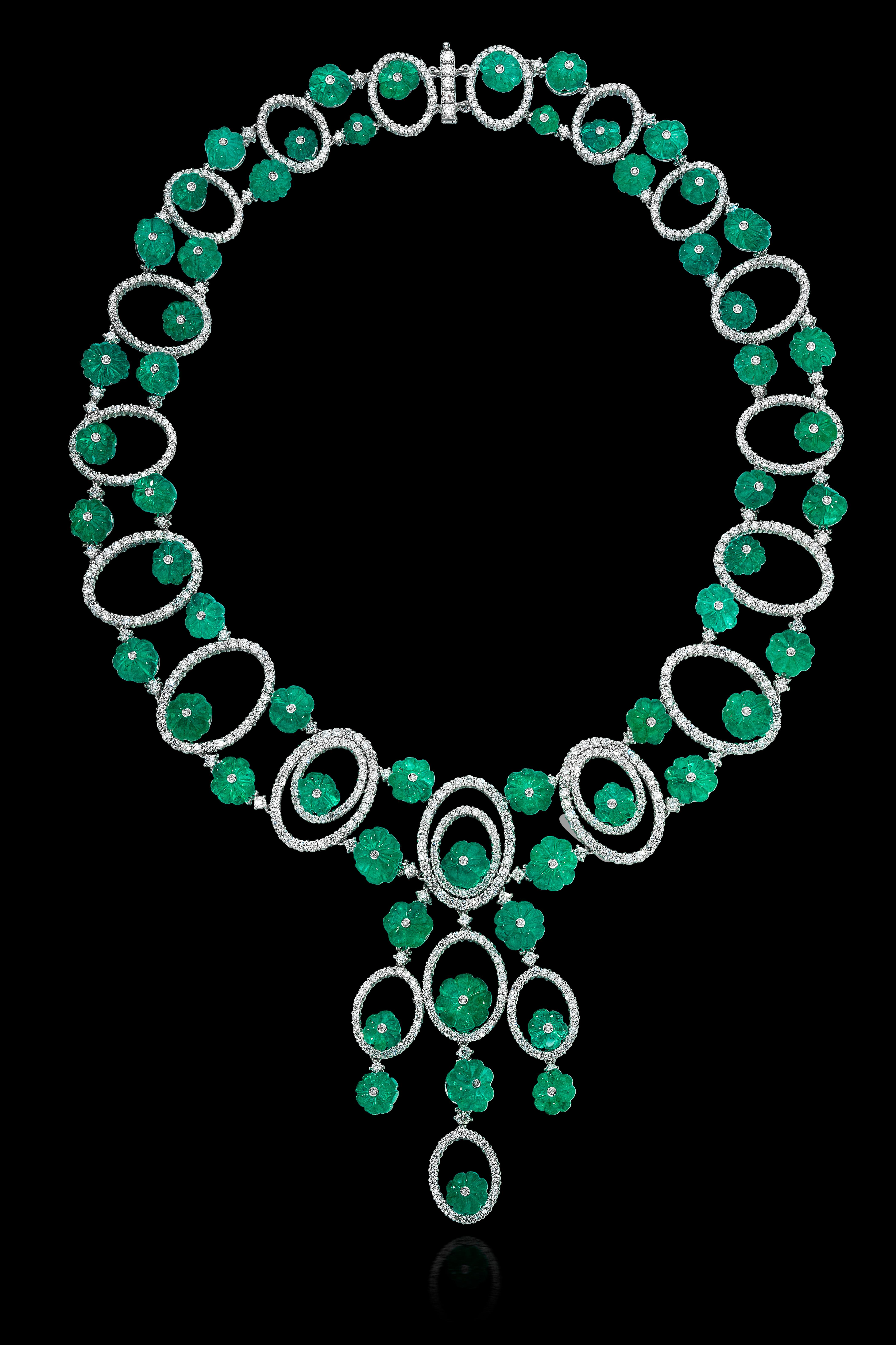 Andreoli Carved Colombian Emerald Melon Diamond Necklace Sphere Drop 18KT Gold

This Andreoli Masterpiece is surrounded by 21.56 carate of full round cut brilliant diamonds F/G/H Color VS-SI Clarity. There are 199.37 carats of Vivid Green Colombian