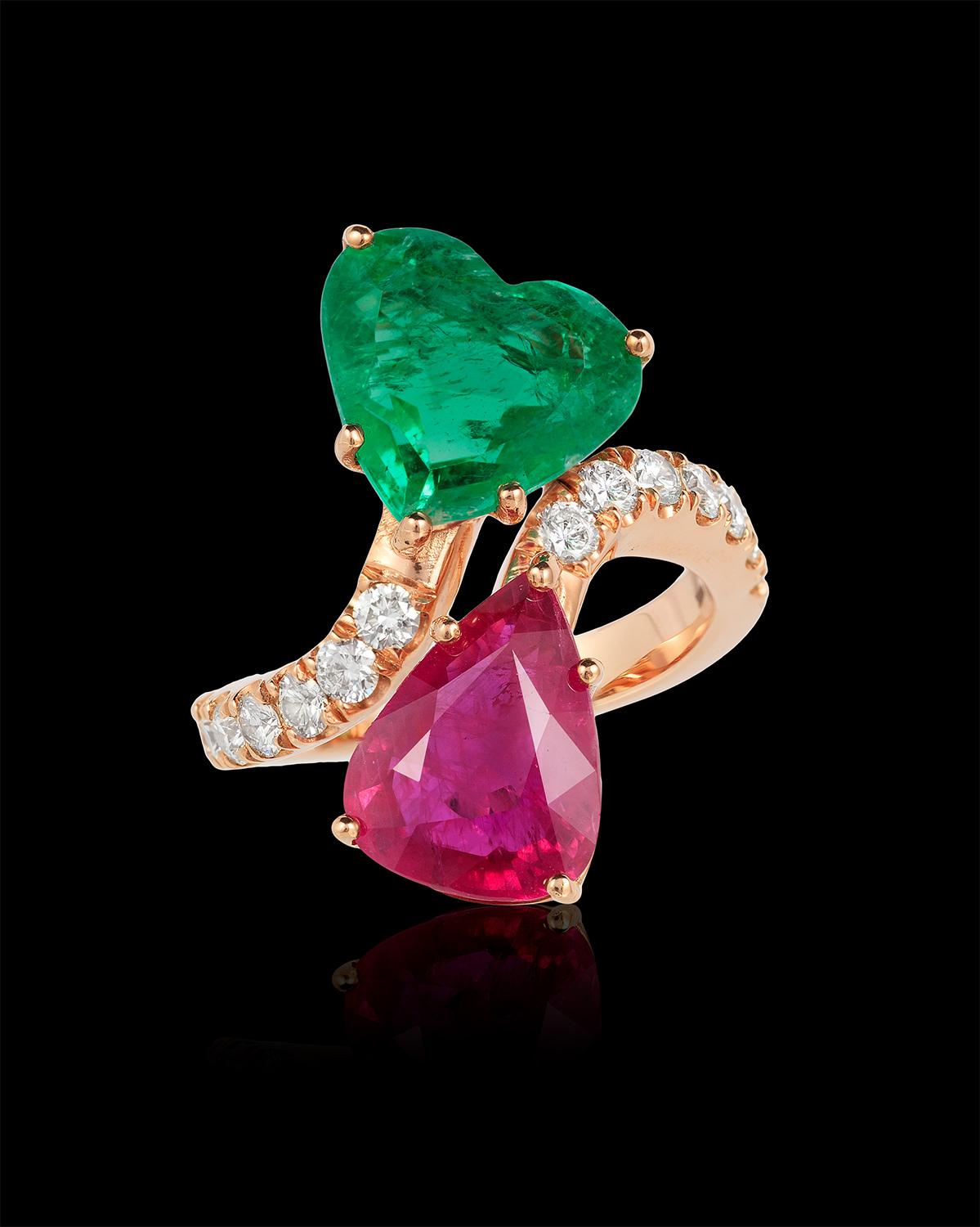 Andreoli Certified 3.84 Carat Colombian Hear tShape Emerald 4.76 Carat Ruby Rin

This ring features:

- 0.83 carat round brilliant cut Diamonds G-H Color VS-SI Clarity
- 4.76 carat CDC Swiss Lab Certified Pear shape ruby Mozambique origin
- 3.86