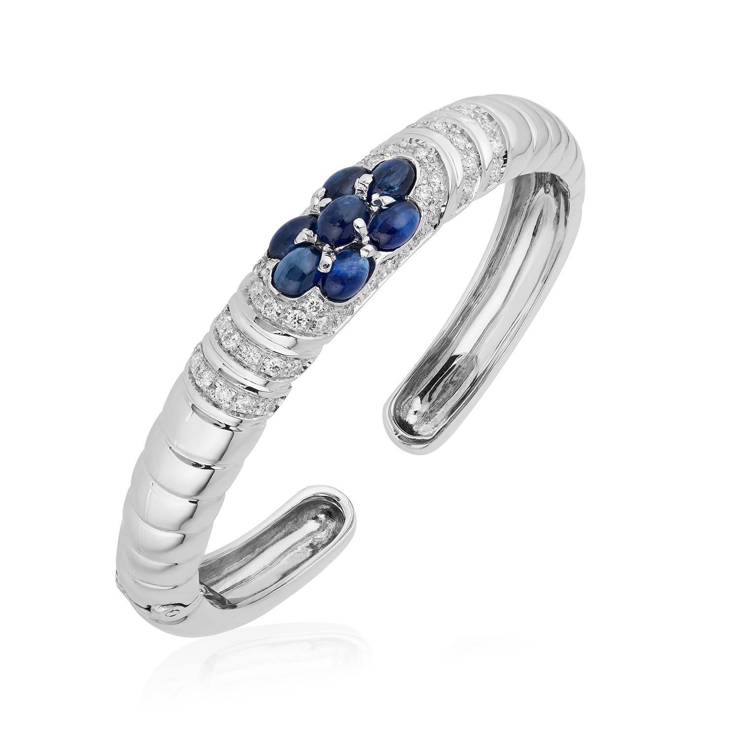 Andreoli Diamond Blue Sapphire Cabochon 18 Karat White Gold Bracelet

This bracelet features:
- 1.19 Carat Diamond
- 5.68 Carat Blue Sapphire Cabochon
- 41.90 Gram 18K White Gold
- Made In Italy