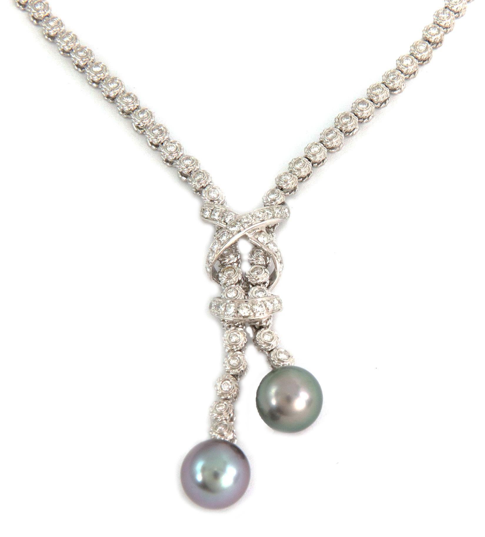 This is a gorgeous necklace by Italian designer  Andreoli, crafted from 18k white gold. The pendant is an X design at the top part with the extended double strand chain all decorated with diamonds and a cross bar below with a 10.5mm Tahitian pearl