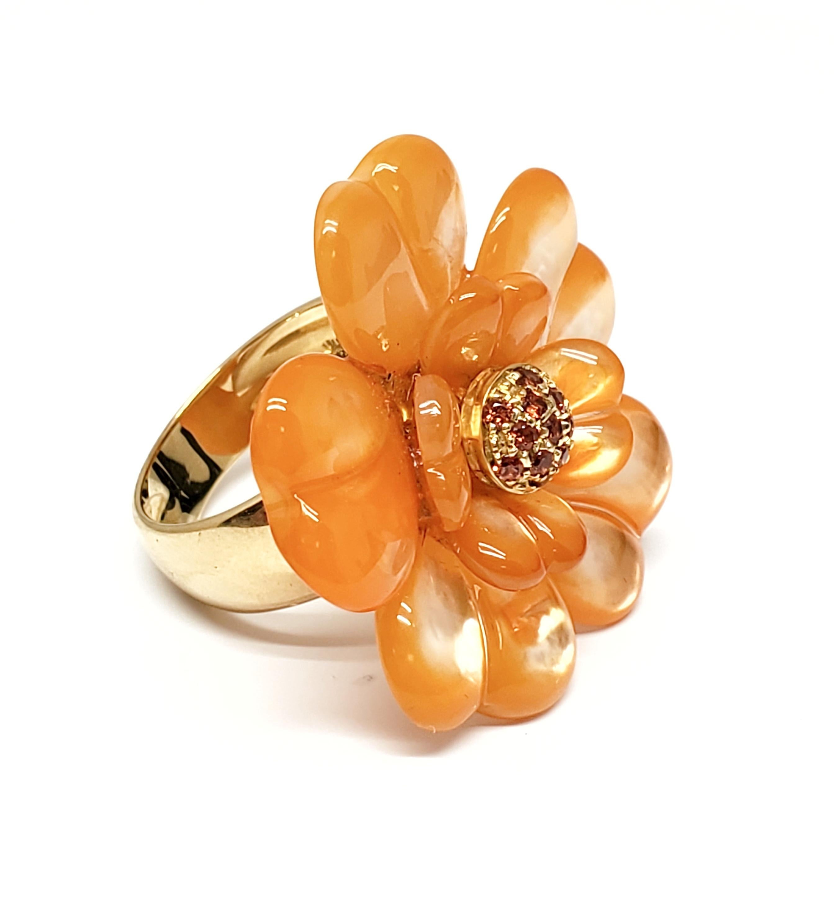Andreoli Orange Dyed Mother of Pearl Orange Sapphire Flower Cocktail Ring

This Ring features:

0.27 carats of round orange sapphires
Dyed Orange Mother of Pearl
8.55 grams 18 Karat Yellow Gold

Matching earrings available sold separately