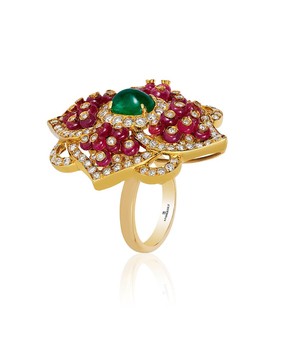 Andreoli Emerald Ruby Dome Diamond Cabochon Bead Art Deco Style 18KT Yellow Gold. This ring features a beautiful 2.20 carat dome shaped emerald cabochon center stone accented with 8.20 carats of ruby bead cabochon each individual ruby cabochon bead