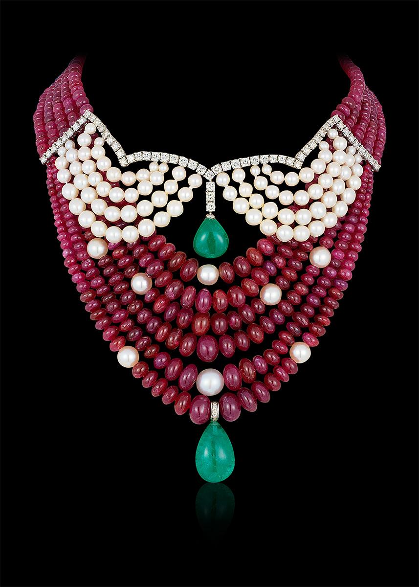Andreoli Emerald Zambian Drop Cabochon Ruby Burma Akoya Pearl Necklace Diamond. This necklace features 730.82 carats of Burmese Burma Ruby Rubies Cabochon Beads accented with 24.97 carats of Japanese Akoya Pearls. Two Zambian Emerald drops weighing