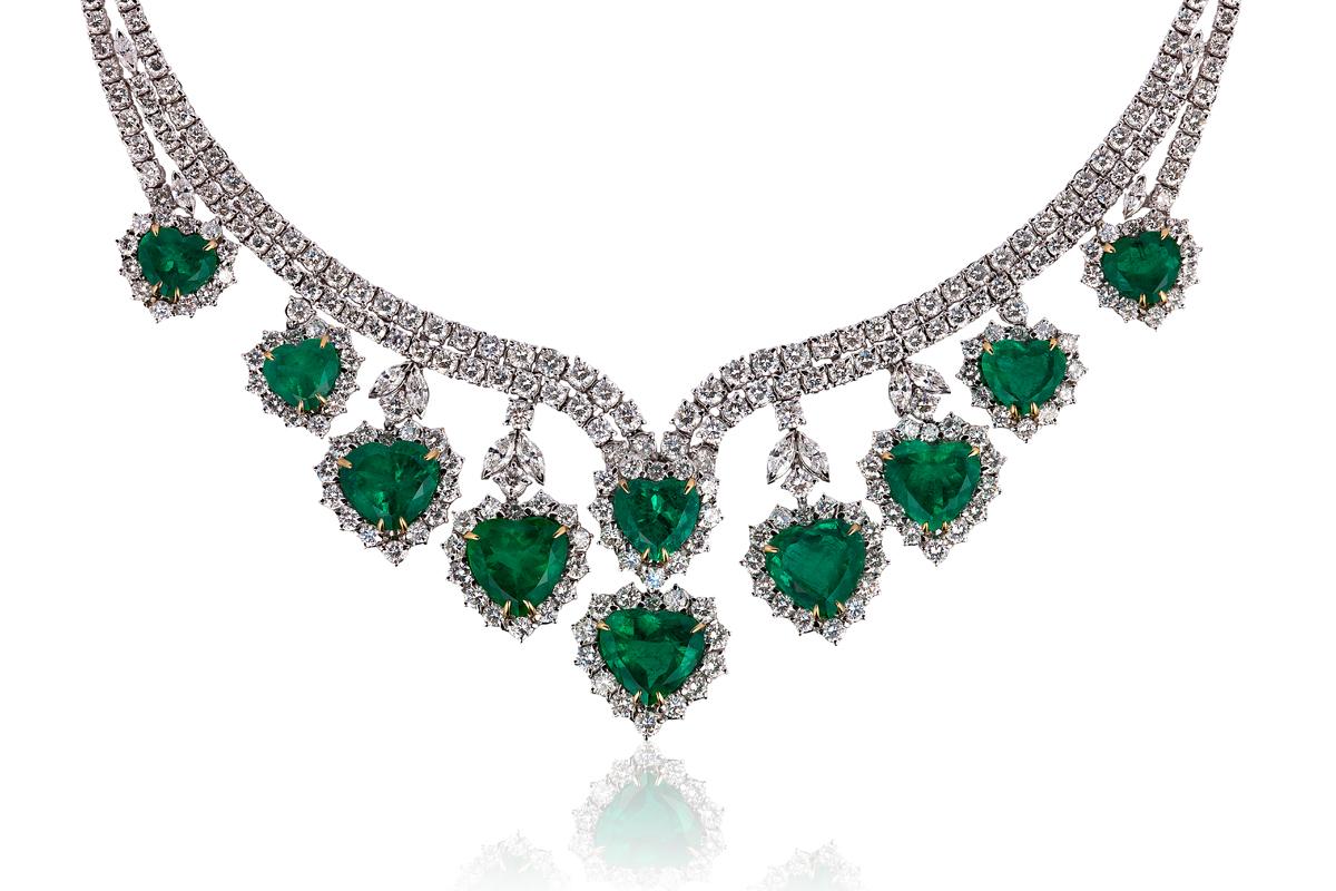 Andreoli Heart Shape Colombian Emerald Diamond Necklace CDC Certified 18KT Gold

This necklace features 10 Vivid Green Colombian Emerald CDC Certified with Minor Oil totaling 35.68 carats. Delicately accented by numerous Round Full cut Brilliant