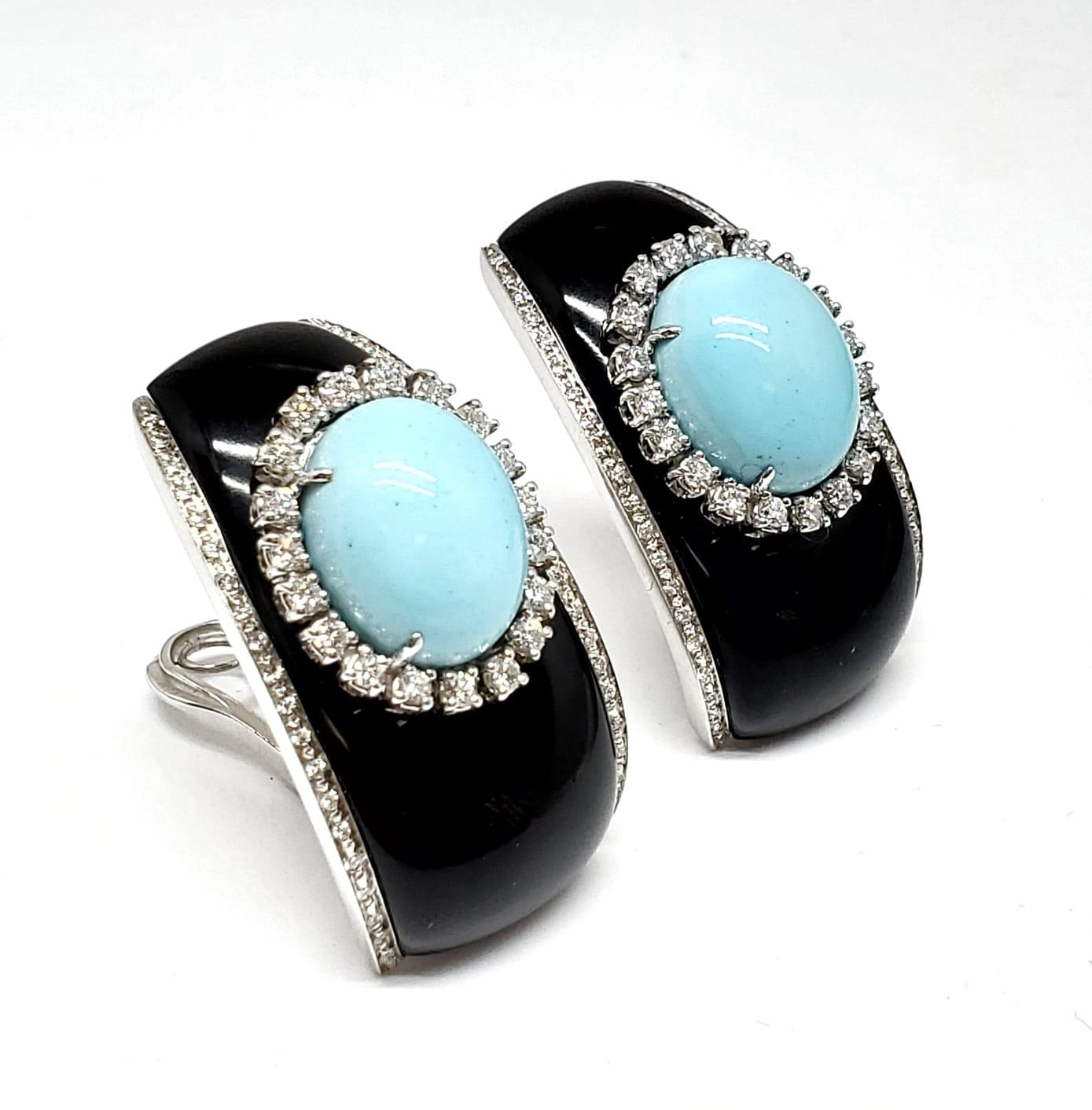 Andreoli Onyx Diamond Italian Turquoise Clip On 18k White Gold Earrings

These Andreoli earrings features:

- 1.61 carat Diamond
- 2.90 grams Reconstituted Italian Turquoise
- 7.20 grams Onyx
- 29.40 grams 18 Karat white gold
- Made in Italy