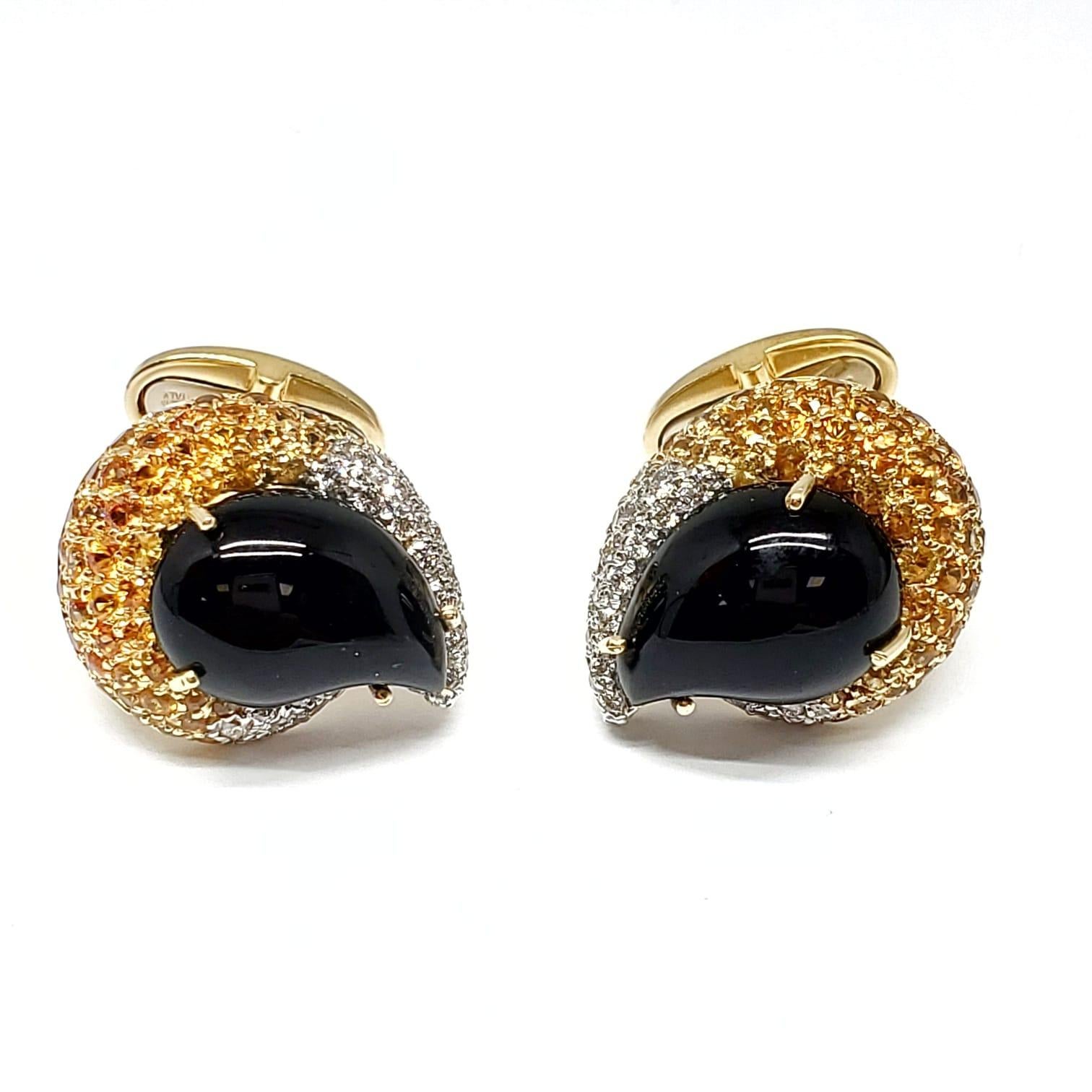 Andreoli Onyx Yellow Sapphire 18 Karat Yellow Gold Mens Cufflinks

This Andreoli cufflinks features:

- 0.75 carat Diamonds
- 3.11 carat Yellow Sapphire
- Onyx Center Stones
- 19.60 grams 18 Karat Yellow Gold
-One Of A Kind 
- Made in Italy
