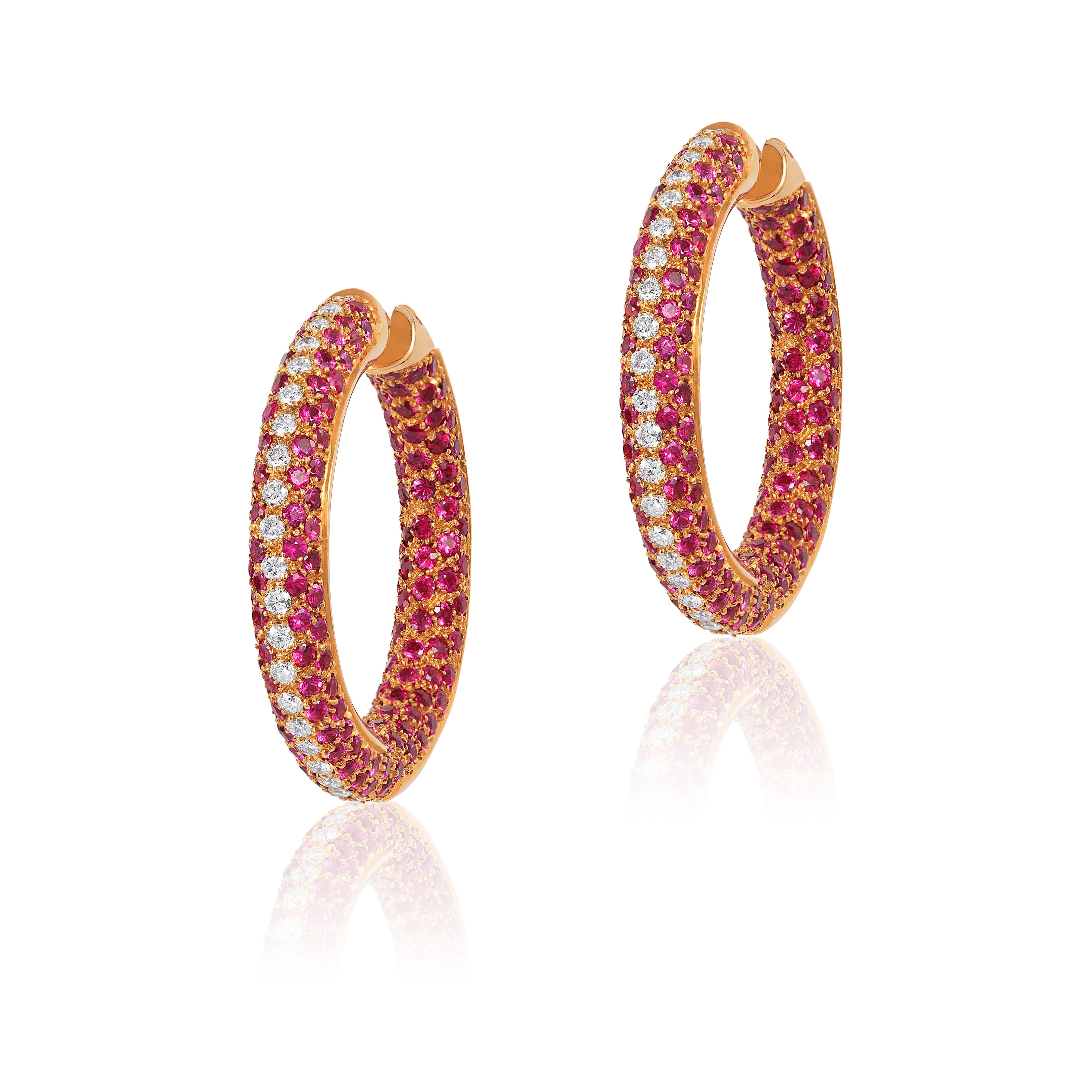 Andreoli Pink Sapphire Diamond Pave 18 Karat Rose Gold Hoop Earrings. These earrigns feature 1.25 carats of F-G-H Color VS-SI Clarity Brilliant round cut diamonds, 10.22 carats of round pave pink sapphires set in 34.80 grams of 18 Karat Rose Gold.