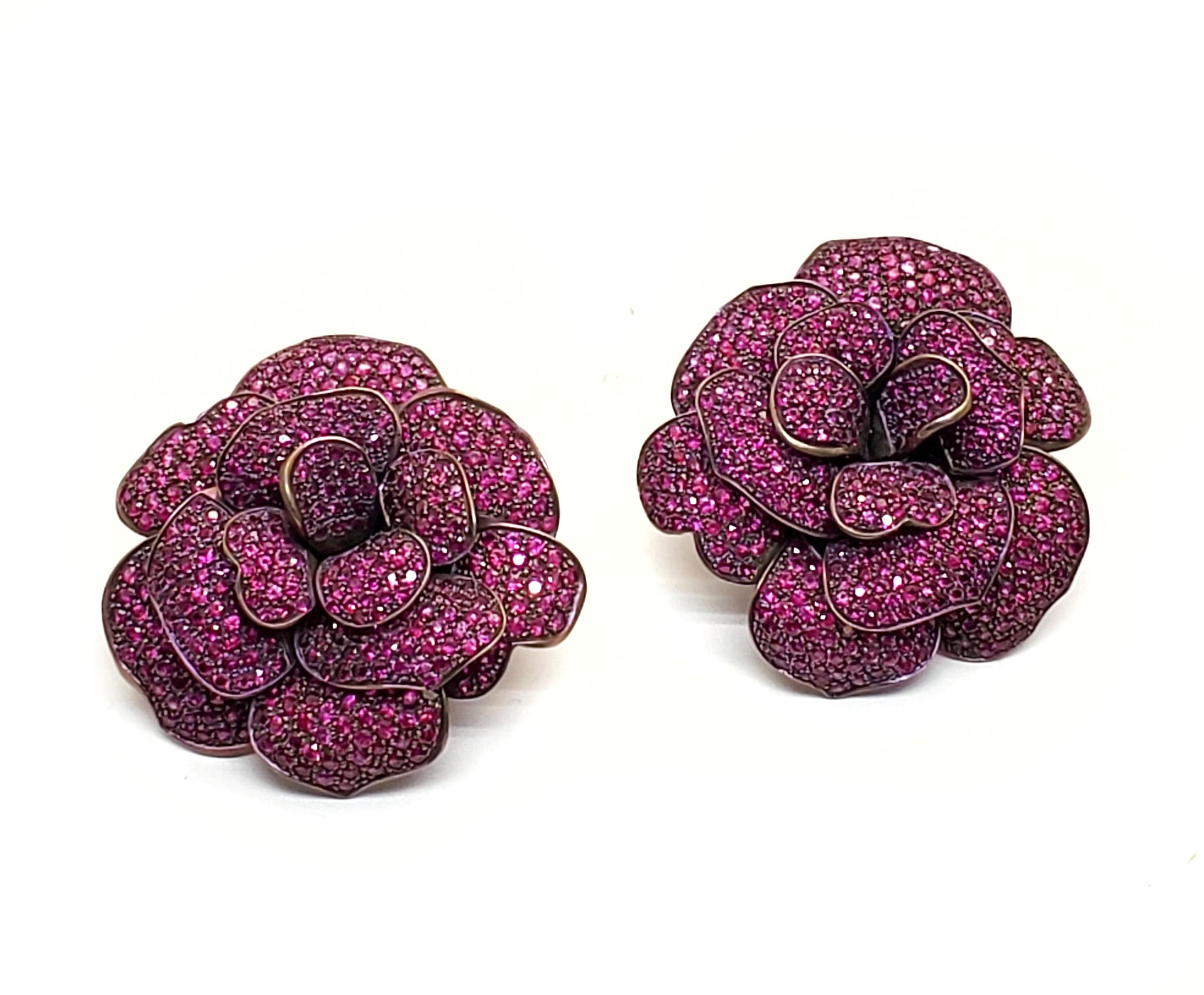 Andreoli Pink Sapphire Titanium Flower Clip On Earrings  

Andreoli was one of the first jewelry creators to utilize titanium in high jewelry over 18KT or Platinum. The use of titanium allows for bigger and bolder designs without compromising on the