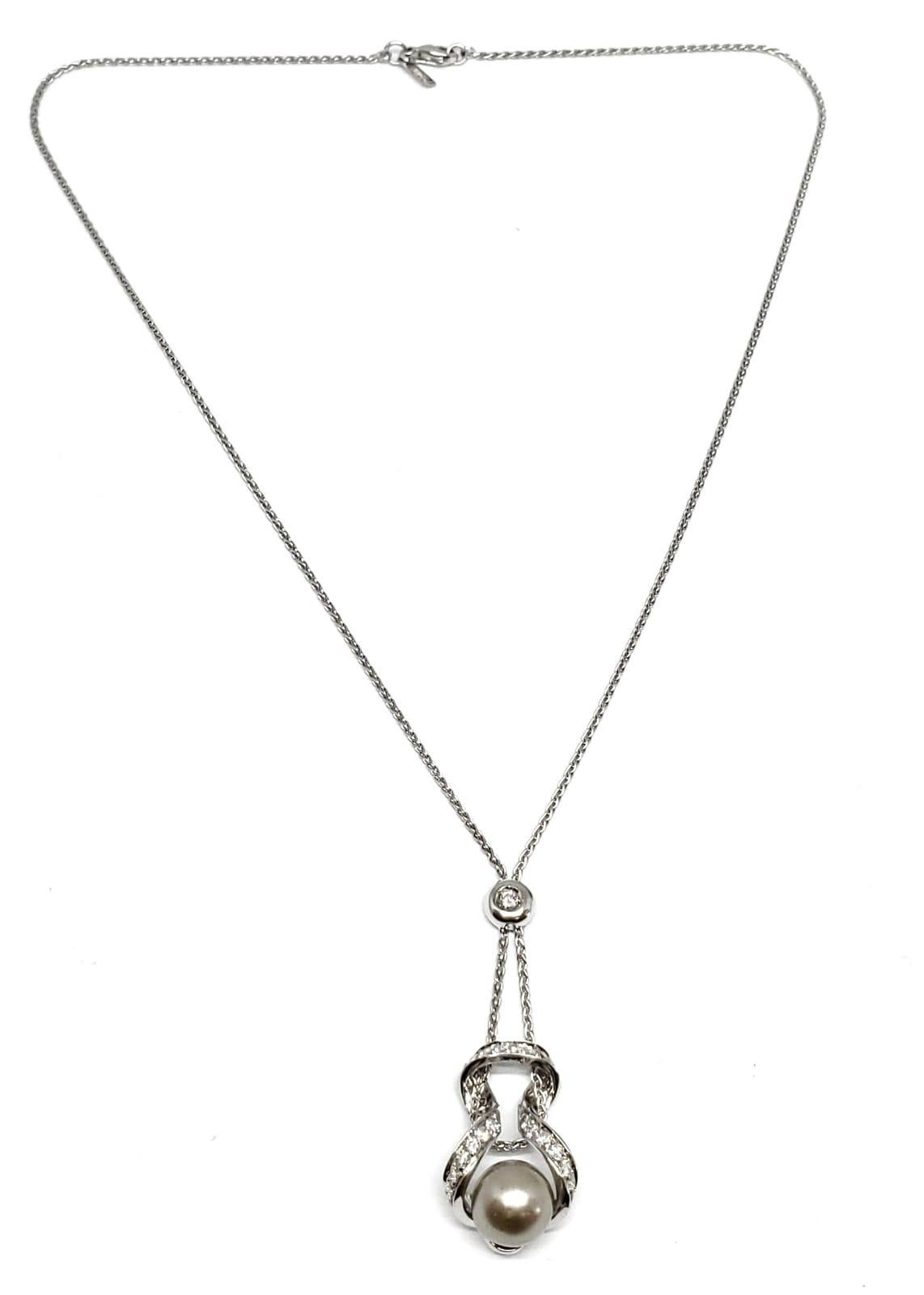 Andreoli Tahitian Pearl Diamond Pendant 18 Karat White Gold Chain Necklace

This Andreoli Pendant features:

- 0.76 carat Diamond
- 9.70mm Tahitian Round Pearl
- 10.00 grams 18 Karat White Gold
- Made in Italy