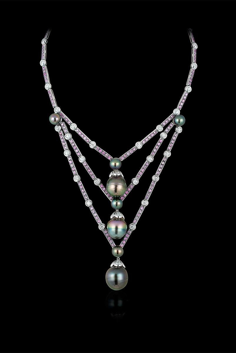 Andreoli Tahitian Pearl Drops Pink Sapphire Diamond Necklace Pearls 18KT Gold

This necklace features 3.45 carats of round full cut brilliant diamonds with 5.62 carats of round full cut pink sapphires. The tahitian pearls range from 8 mm to 17 mm