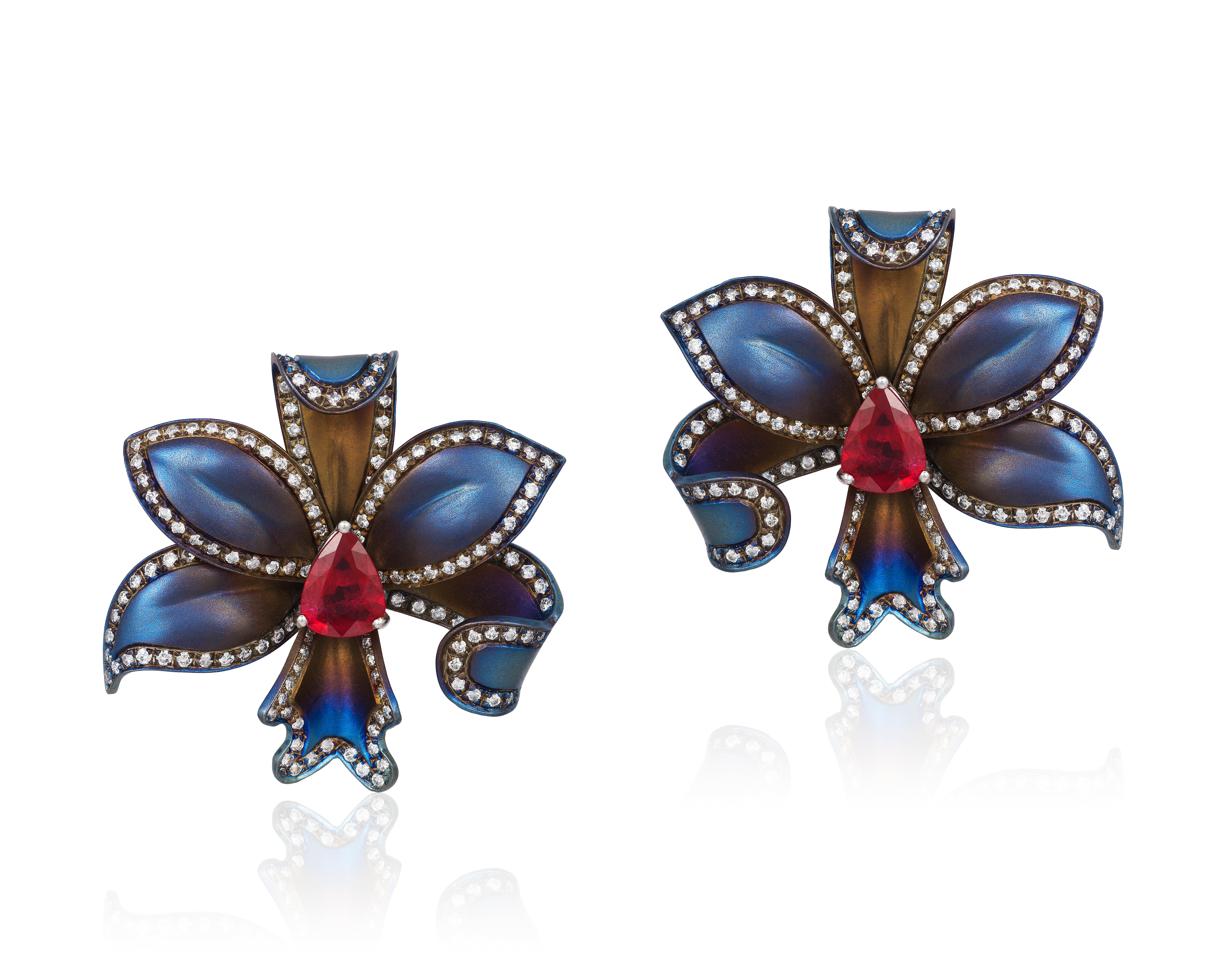 Andreoli Titanium Ruby Diamond Flower Earrings Clip On Ear. Andreoli was one of the first jewelry creators to utilize titanium in high jewelry over 18KT or Platinum. The use of titanium allows for bigger and bolder designs without compromising on