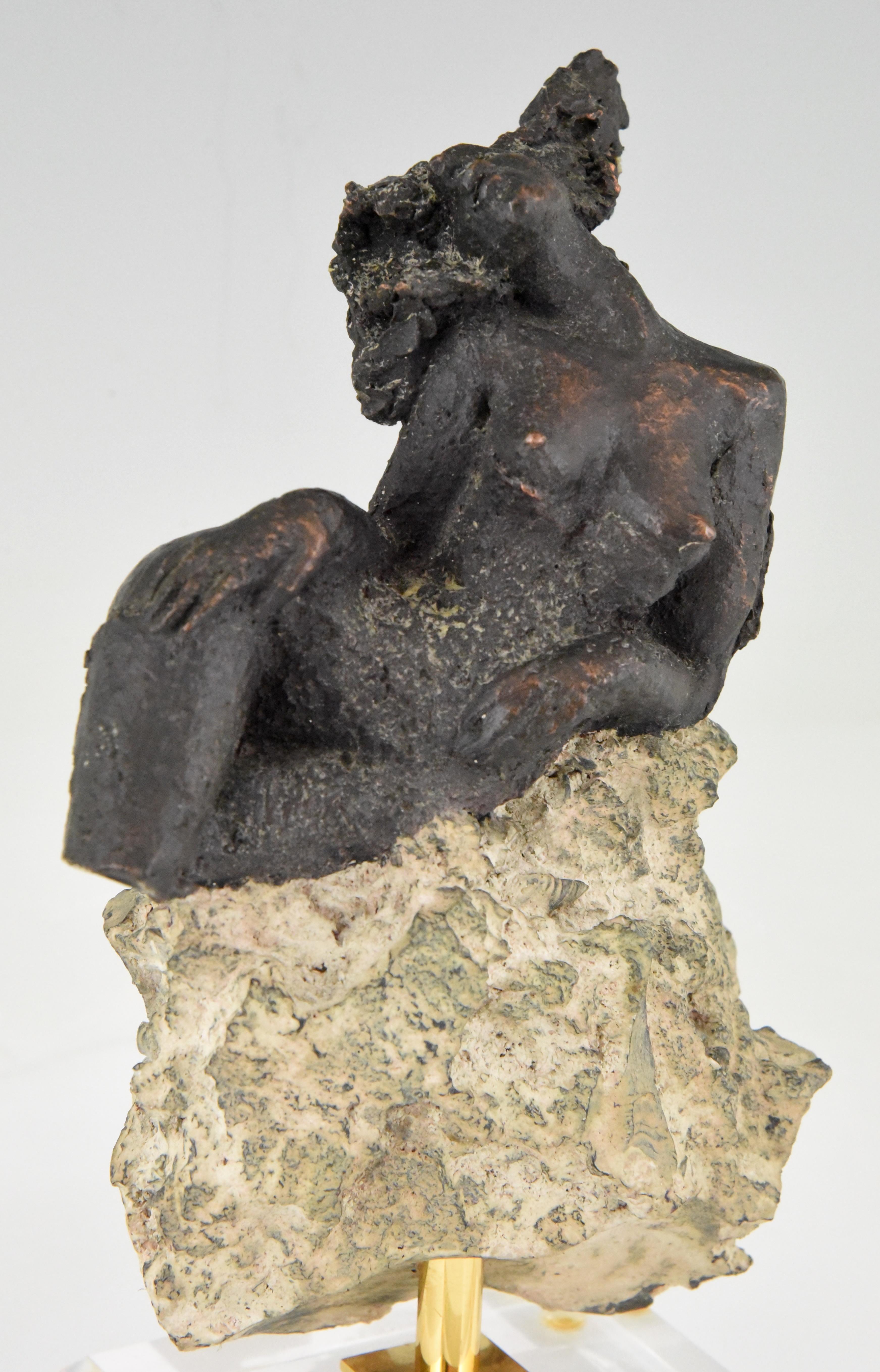 Modern sculpture of a nude on a rock signed and numbered by Andres Peralta, a Spanish artist, circa 1980.