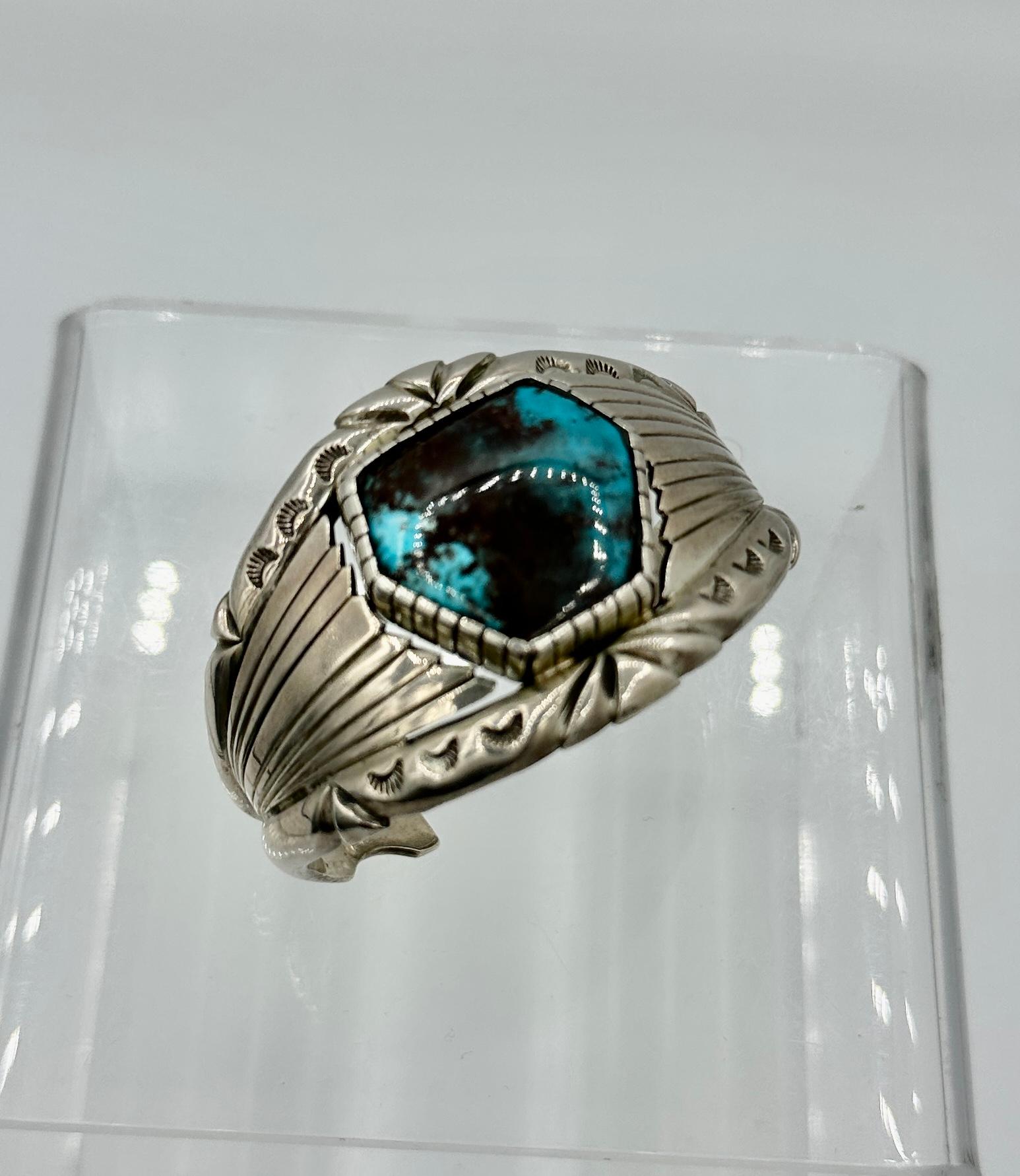 THIS IS A MAGNIFICENT ANDREW ALVAREZ TURQUOISE STERLING SILVER CUFF BRACELET.
This outstanding vintage cuff is from the celebrated artisan Andrew Alvarez whose work is considered to be amongst the finest native jewelry in the world.  Extremely heavy