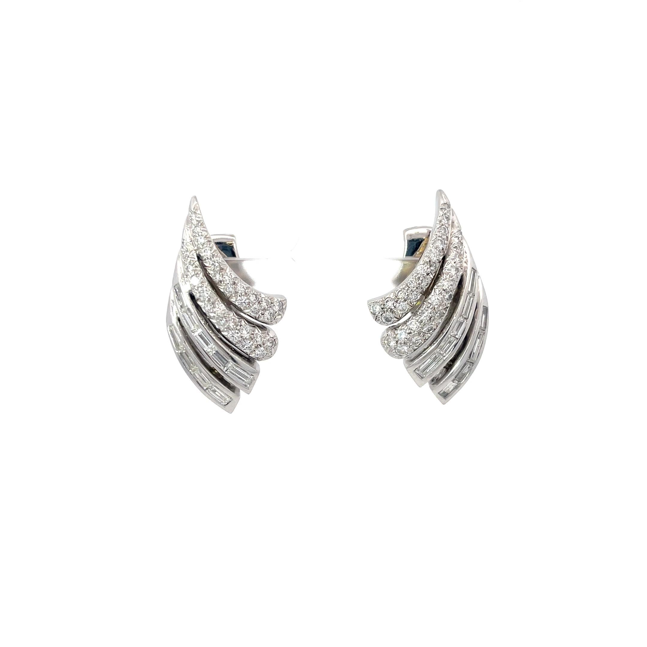 Andrew Clunn Diamond Earrings in Platinum. The earrings feature 3ctw of brilliant round and baguette diamonds. 
1.50