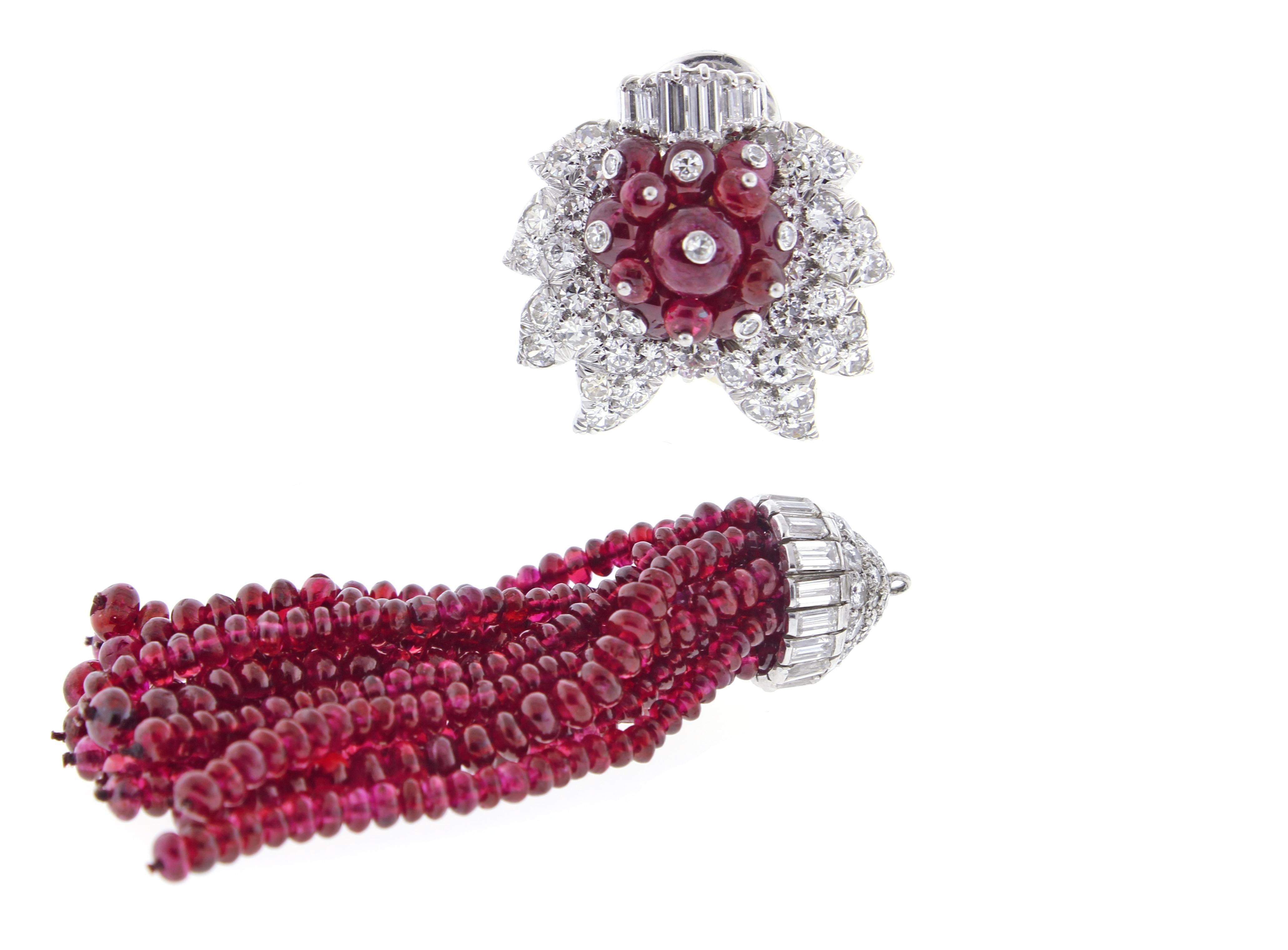 From Andrew Clunn, and pair of diamond and ruby tassel earrings. The earrings feature over 125 carats of fine Burma ruby beads and 7 carats of diamonds. The tassel is detachable.  Clunn worked for  David Webb for almost 12 years becoming Webb's