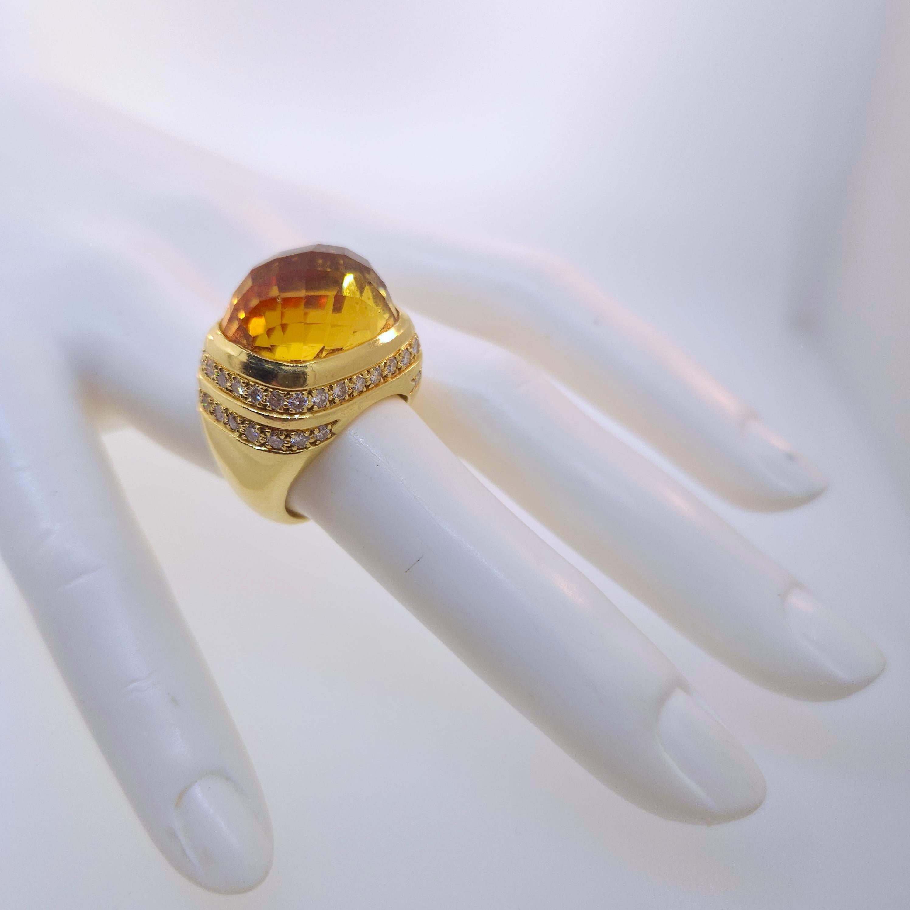 Thank you for viewing this beautiful Andrew Clunn 18k yellow gold diamond and citrine dome ring.  The ring contains a checkerboard cut citrine measuring 18 x 14mm.  There are 46 diamonds weighting approximately 1.50 carats. The diamond quality is G