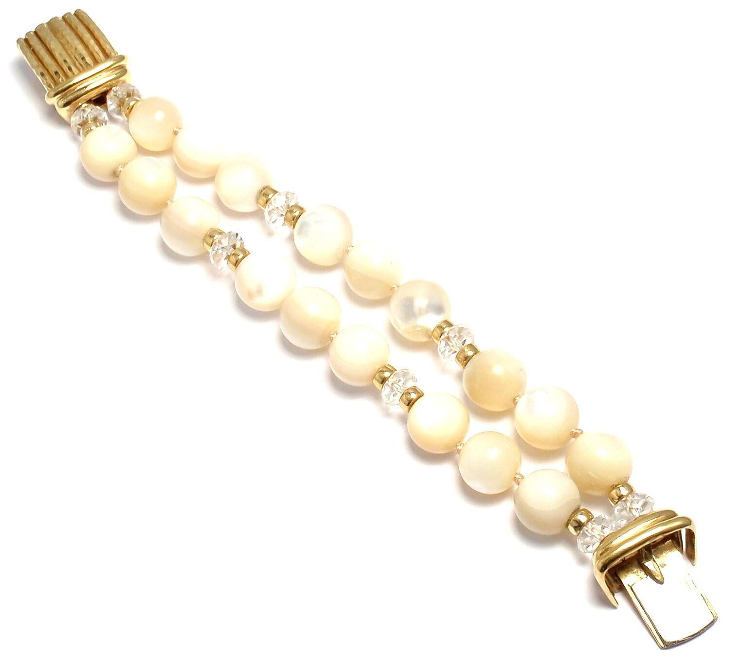 18k Yellow Gold Mother Of Pearl And Crystal Bead Bracelet by Andrew Clunn. 
With 18 total Mother of pearl beads 12mm each & 8 crystal beads 8mm each.
Details: 
Length: 7