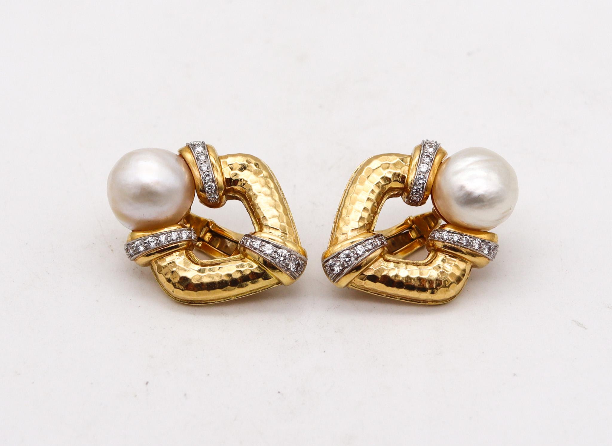 Clip on earrings designed by Andrew Clunn.

Great pair of ear-clips, created in New York city at the jewelry atelier of Andrew Clunn. These pieces has been crafted with hammered patterns in solid rich yellow gold of 18 karats with high polished