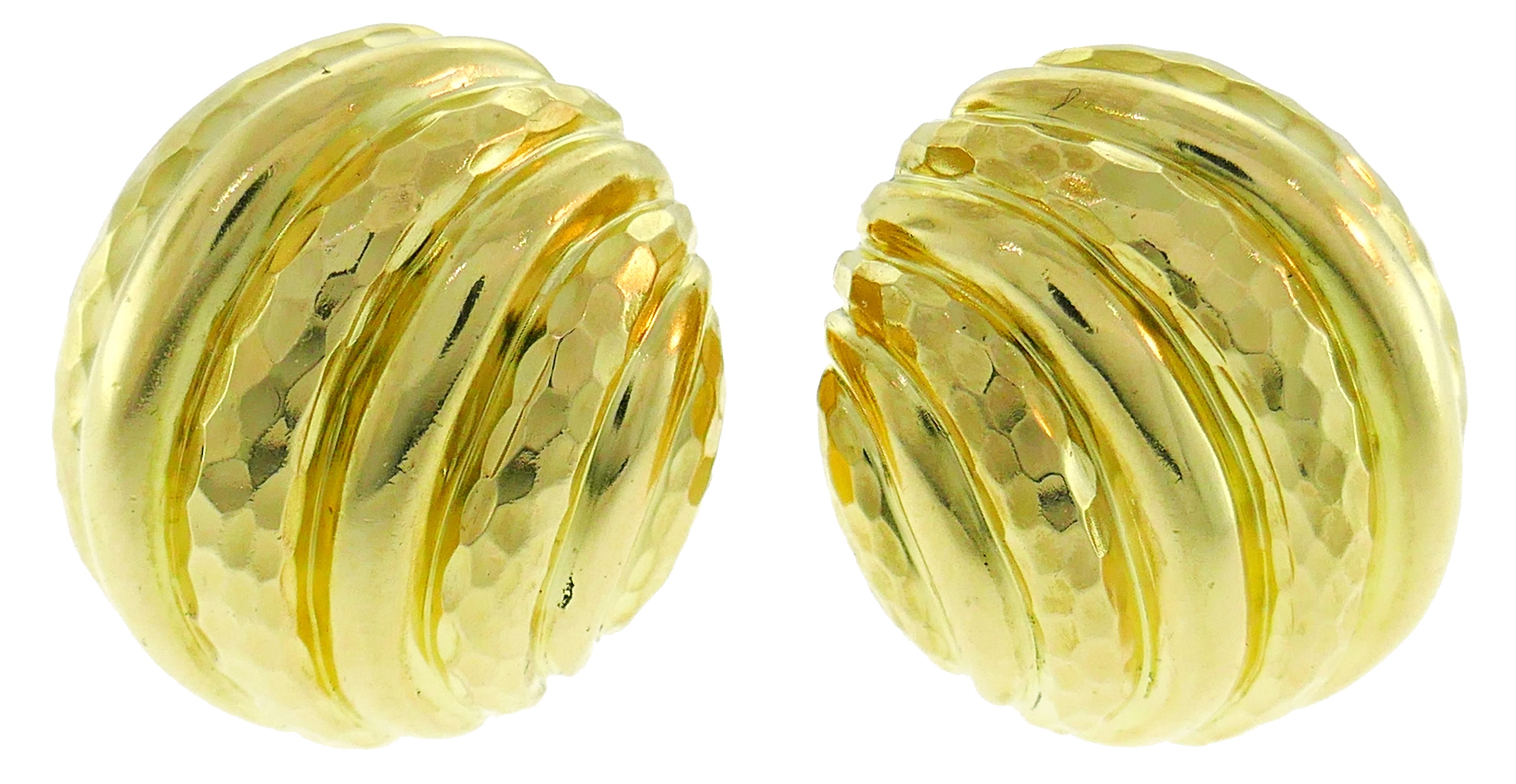 Bold and elegant clip-on earrings created by Andrew Clunn in the 1980s. Versatile, chic and wearable, the earrings are a great addition to your jewelry collection. 
Made of 18 karat (stamped) yellow gold, carved rock crystal and accented with a
