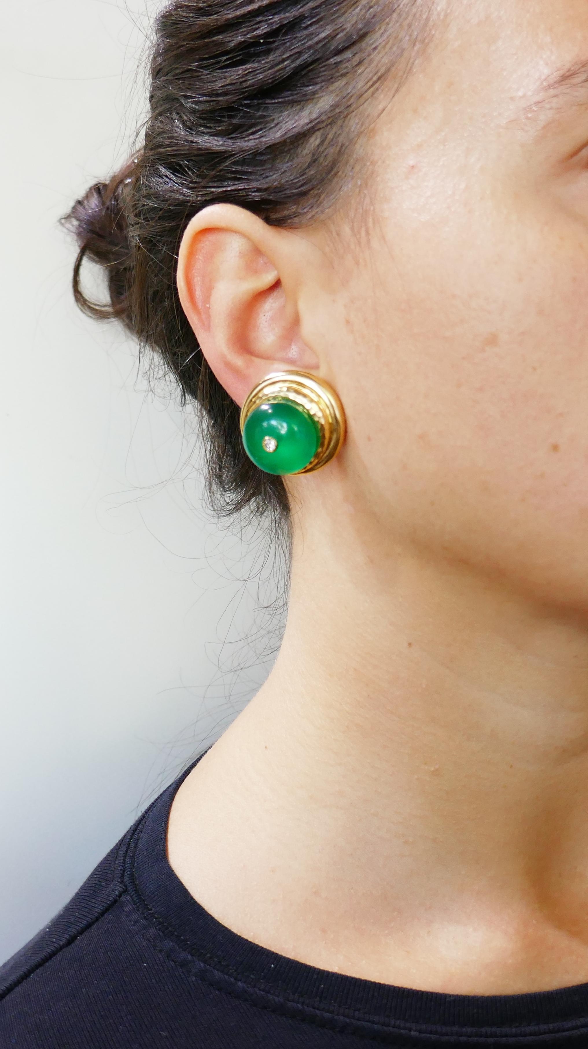 Bold and colorful set consisting of a pair of earrings and a pendant created by Andrew Clunn in the 1980s. Elegant, chic and wearable, the set a great addition to your jewelry collection. 
Made of 18 karat (stamped) yellow gold and chrysoprase