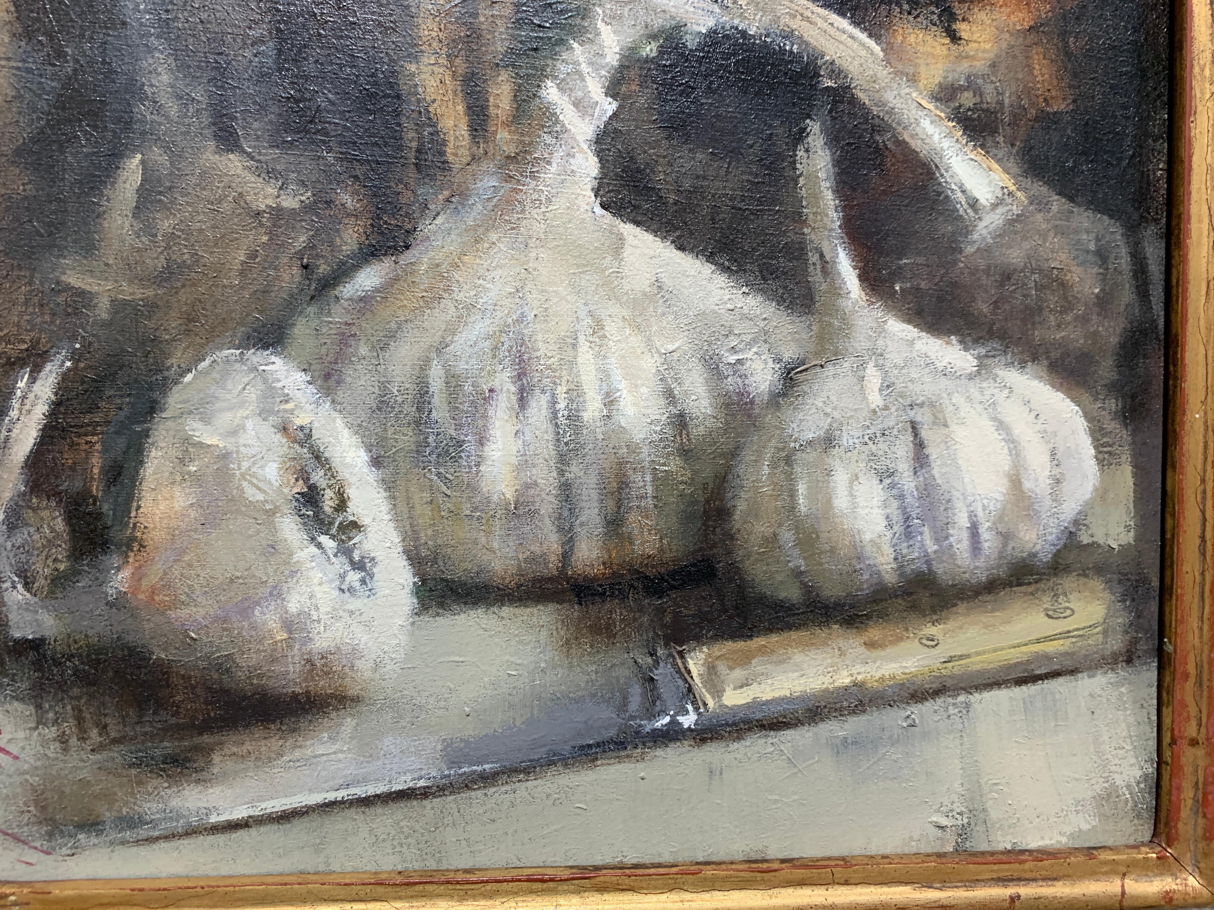 Modern British, Still life of garlic on a kitchen table in an interior. - Painting by Andrew Davis