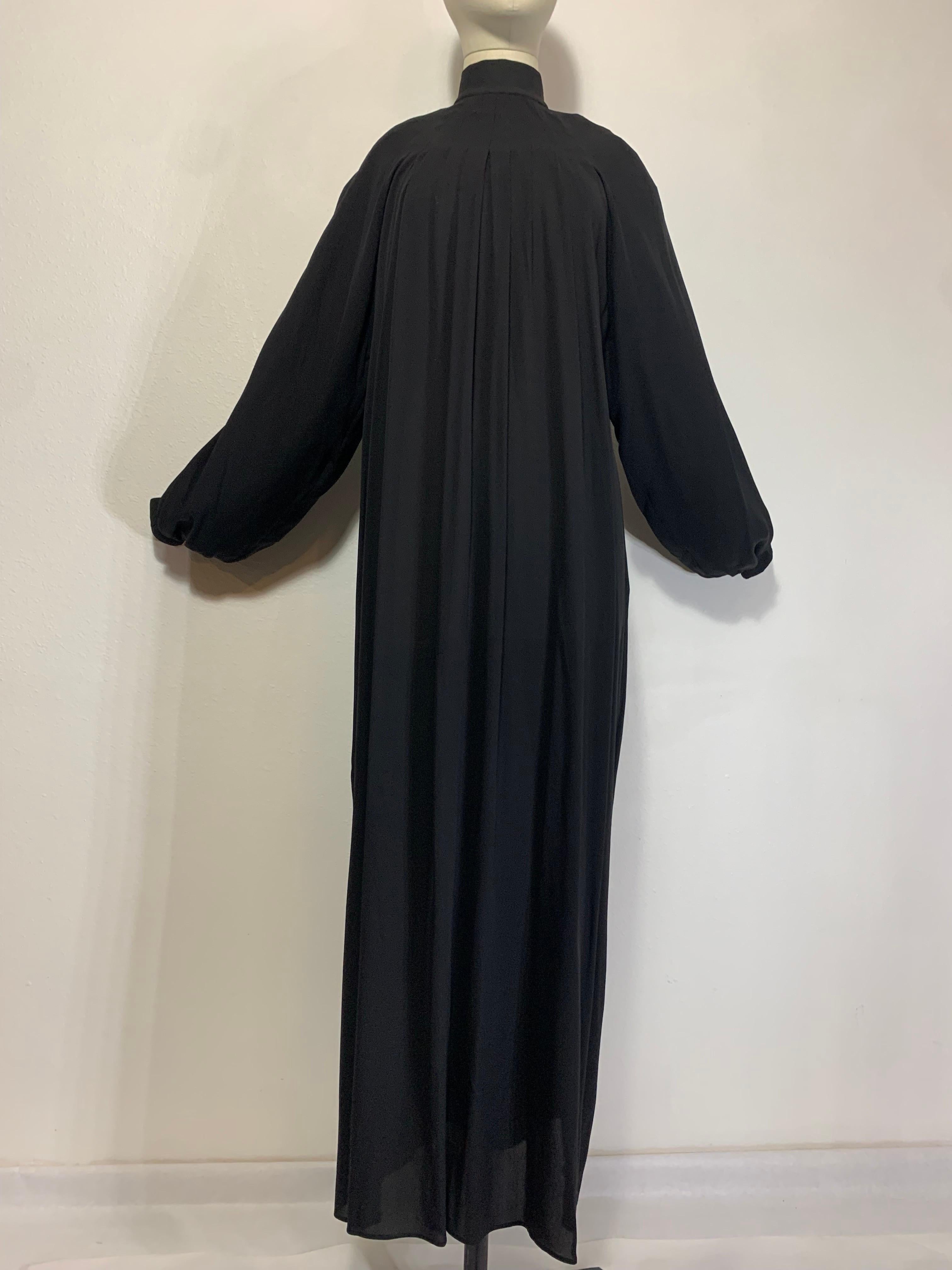 Andrew Gn Black Silk Crepe Monastic-Styled Maxi Dress w Full Pleats & High Neck:  This dramatic silhouette is striking in its simplicity with full body pleating from shoulder yolk and a high mock turtleneck collar. Full banded and gathered snap-cuff