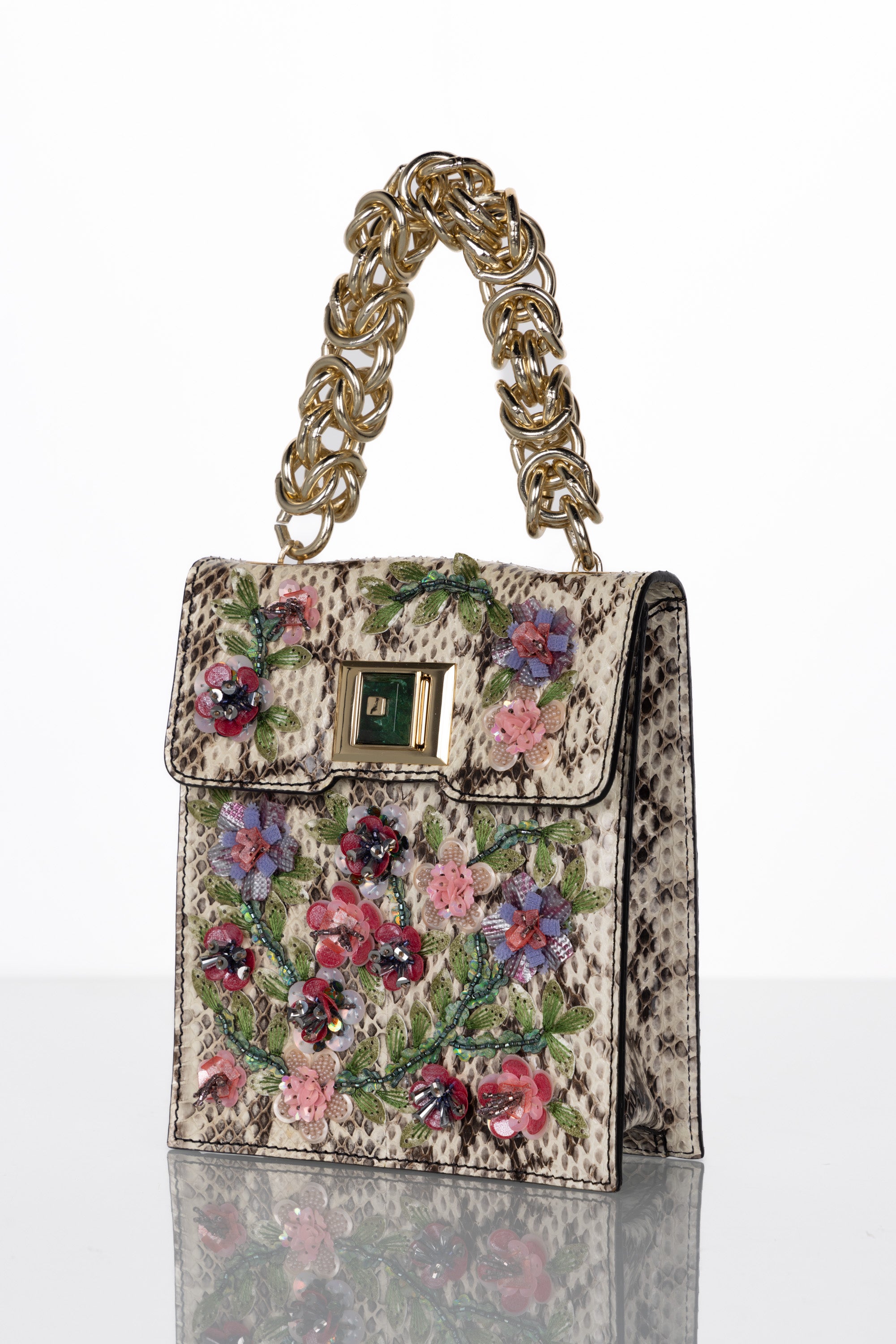 Gorgeous Andrew GN Bag done in snakeskin with beaded flower embellishments. Twist lock closure is a Chrysocolla gemstone. This bag is in excellent new condition with tags.
 
Handle drop: 4.5 inches
Height: 7 inches
Width: 6 inches
Depth: